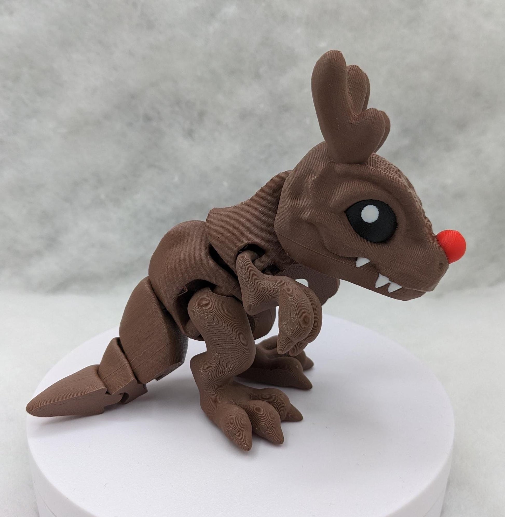 Our Christmas T-Rex combines the charm of Christmas with the fun of dinosaurs. An interactive toy for kids & adults alike,  articulated joints for posing & fidgeting, T-Rex is perfect as a stocking stuffer, desk toy, or playful holiday decoration.