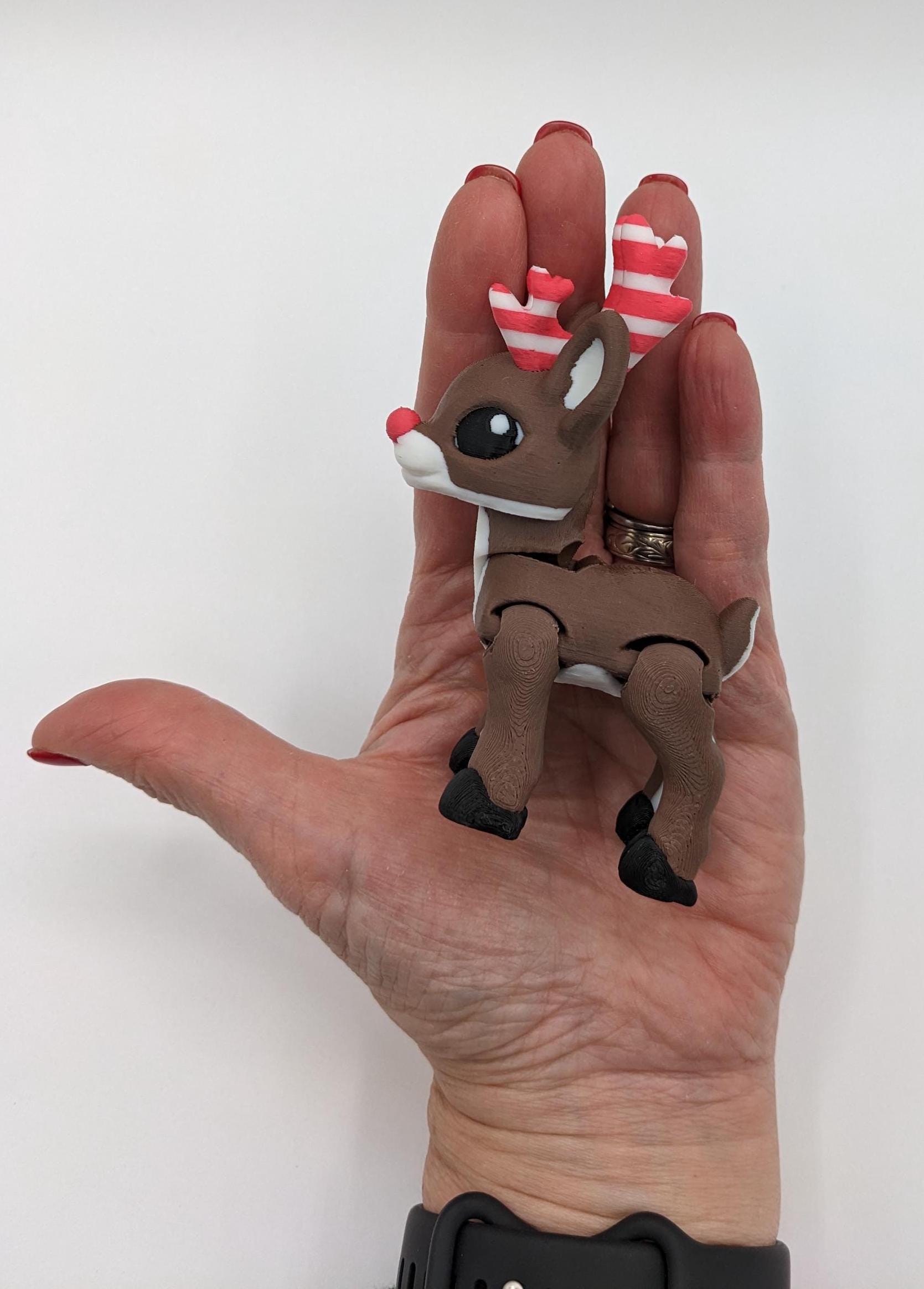 Our baby reindeer, inspired by holiday candy canes, is the perfect blend of fun & festive  creativity. Fully articulated & poseable body, this fidget toy is ideal for stress relief, creative play, or adding a whimsical touch to your Christmas decor.