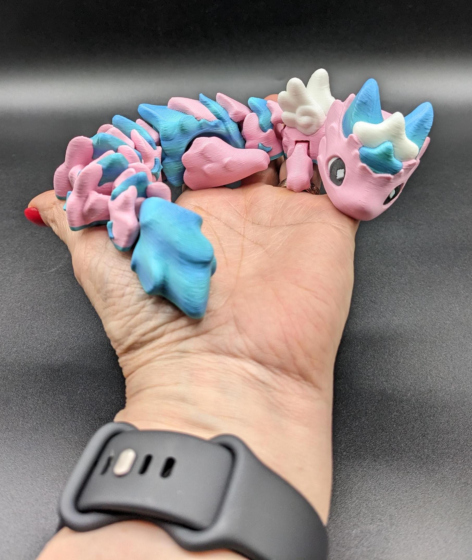 Our Sweet Articulated Baby Atria Fidget Toy is a delightful & interactive creation designed to bring joy, creativity, & stress relief into your life! Our fidget toy features a unique & sweet design making it perfect for fidgeting &  imaginative play.