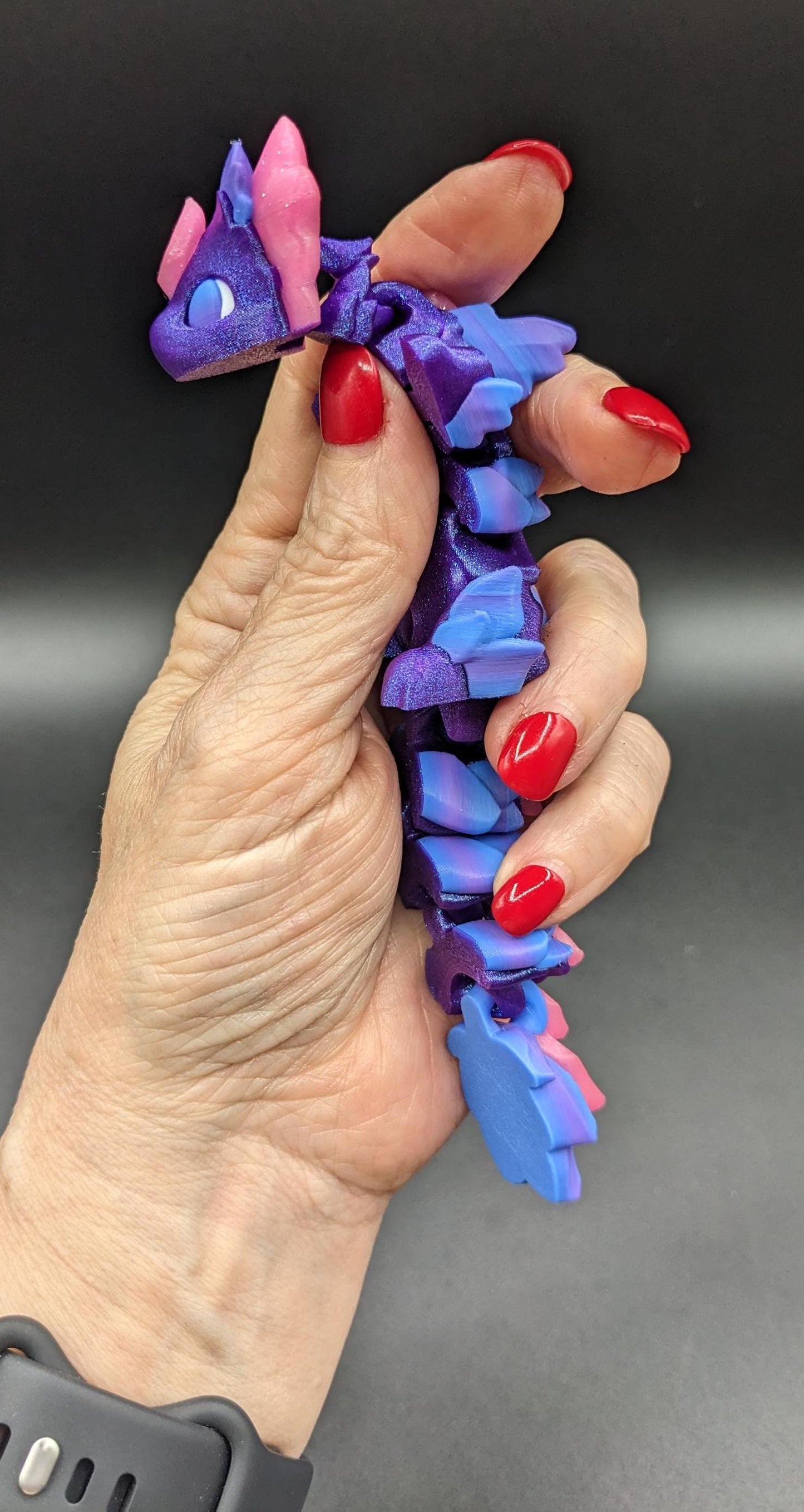 Whether you’re looking for a stress-relief toy, a whimsical desk companion, or a one-of-a-kind gift, Baby RubiKuro is here to charm kids, teens, & adults alike. Colorful, durable, & irresistibly adorable, our baby dragon is the perfect companion.