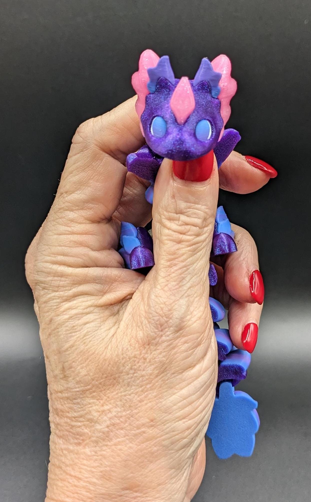 Whether you’re looking for a stress-relief toy, a whimsical desk companion, or a one-of-a-kind gift, Baby RubiKuro is here to charm kids, teens, & adults alike. Colorful, durable, & irresistibly adorable, our baby dragon is the perfect companion.
