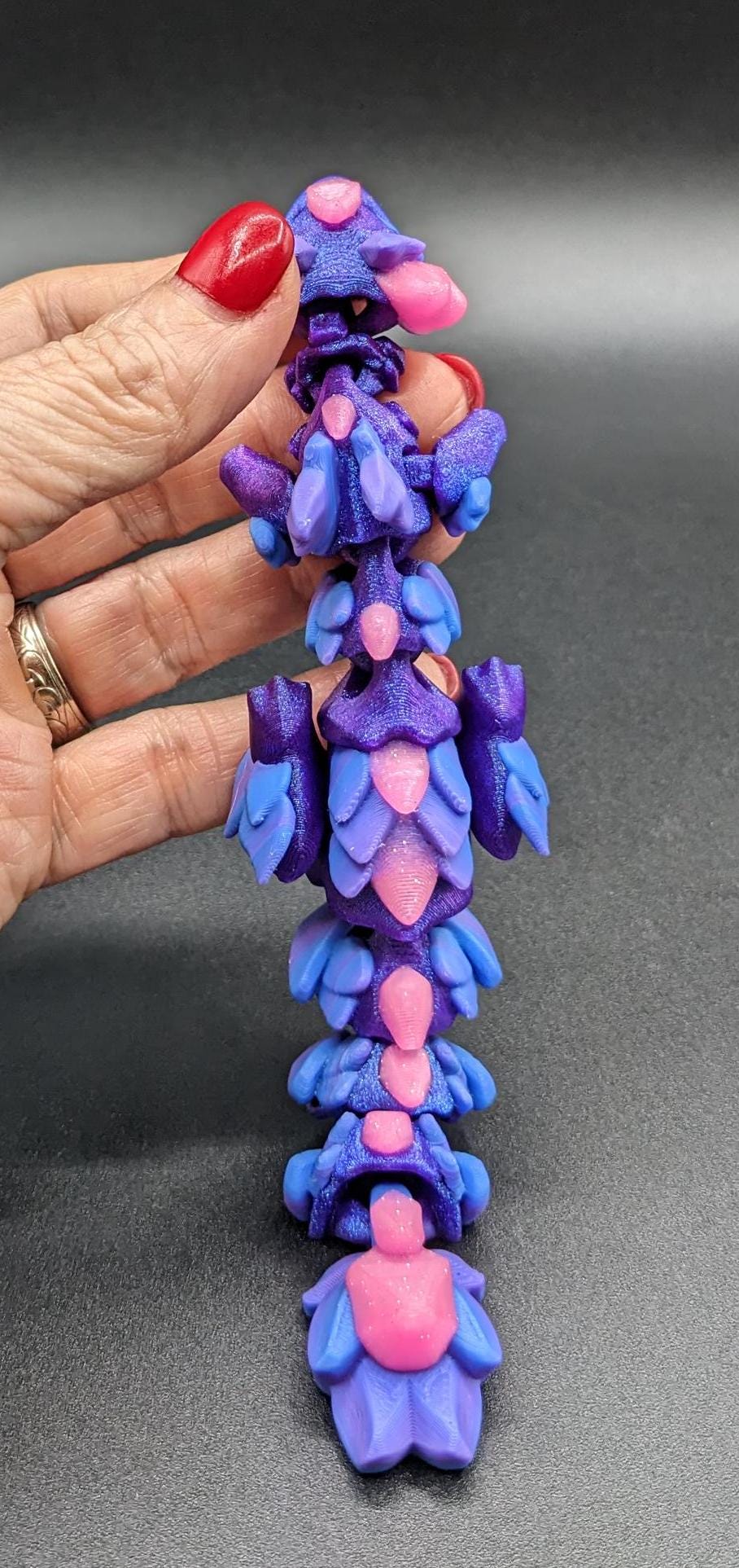 Whether you’re looking for a stress-relief toy, a whimsical desk companion, or a one-of-a-kind gift, Baby RubiKuro is here to charm kids, teens, & adults alike. Colorful, durable, & irresistibly adorable, our baby dragon is the perfect companion.