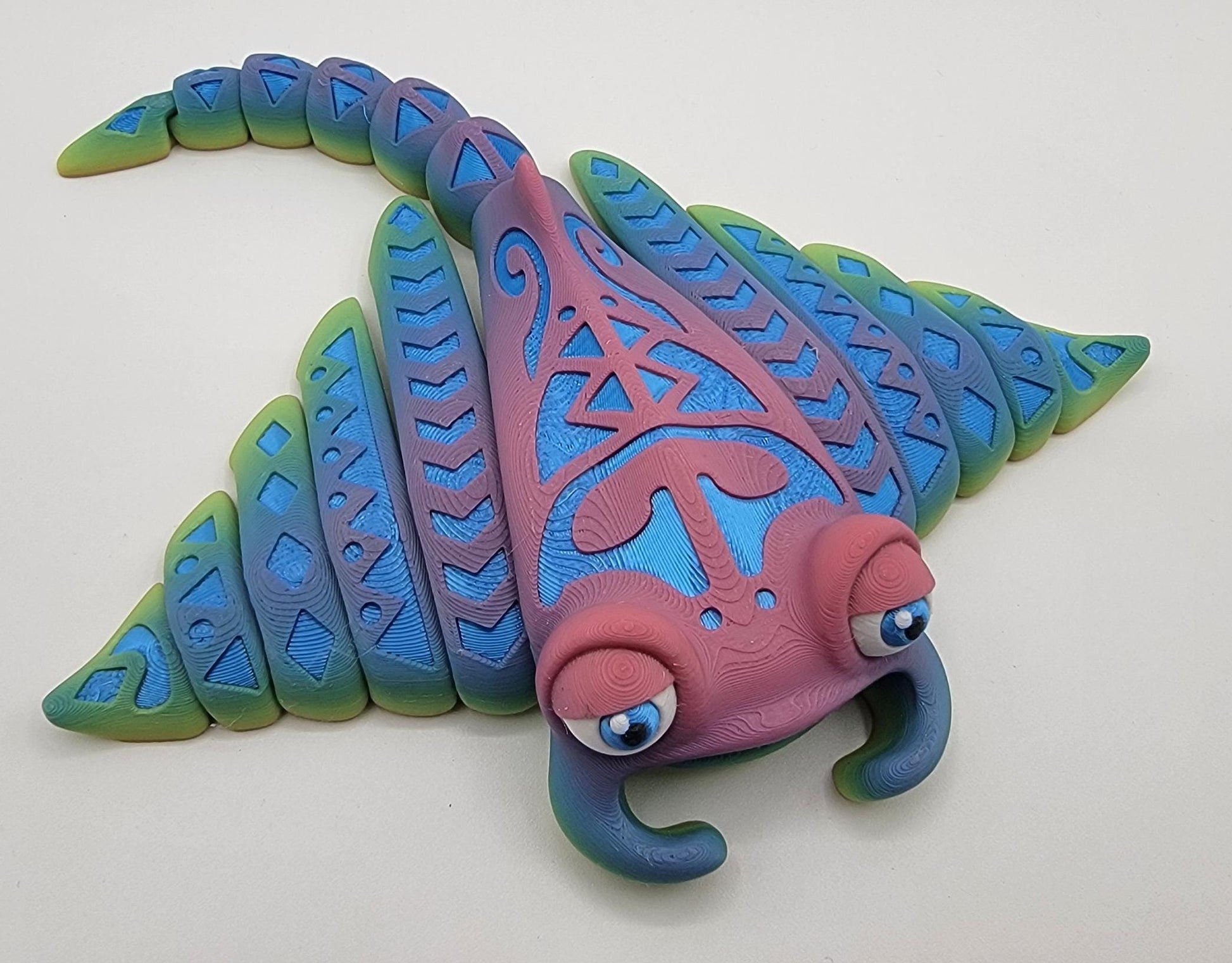 Meet our adorable 3D Printed Tribal Tattooed Manta Ray Fidget Toy – your companion for stress relief and endless fun! Crafted with precision, this Tattooed Manta Ray is more than just a toy; it's a delightful escape from the daily hustle.