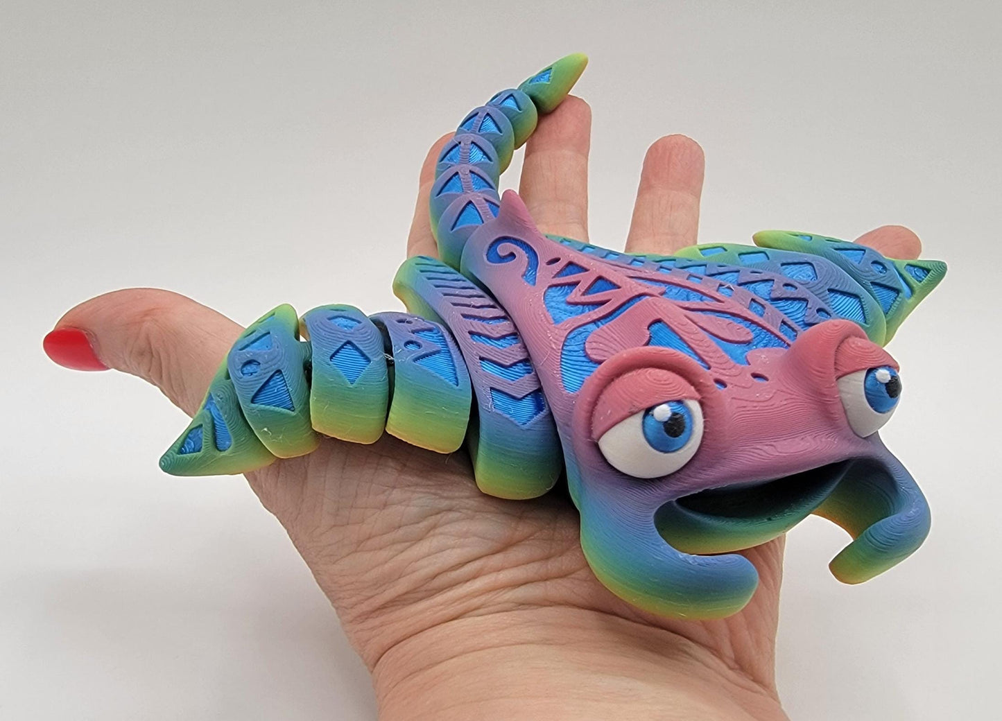 Meet our adorable 3D Printed Tribal Tattooed Manta Ray Fidget Toy – your companion for stress relief and endless fun! Crafted with precision, this Tattooed Manta Ray is more than just a toy; it's a delightful escape from the daily hustle.