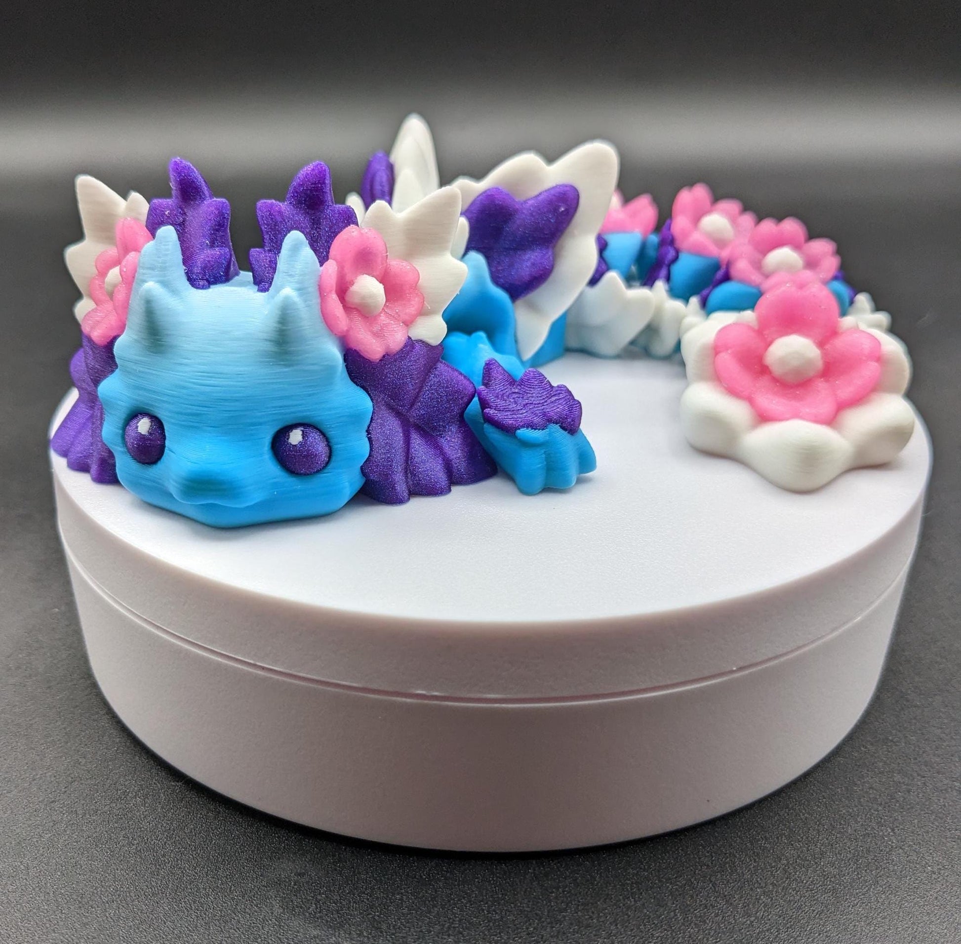 Let the Adorable Baby Kosha Axolotl Flower Dragon bring joy, relaxation, & a touch of enchantment into your life! Whether you’re treating yourself or someone special, this charming fidget toy is a delightful combination of fantasy & creativity.