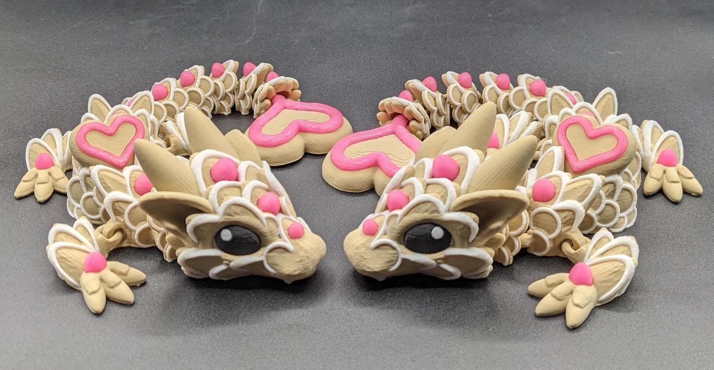 Our adorable 3D-printed dragon combines the whimsical charm of gingerbread cookies, heart-shaped details, & the playful personality of a baby dragon. Whether it’s a holiday gift, an enchanted companion, or a fun fidget toy, this dragon is perfect!