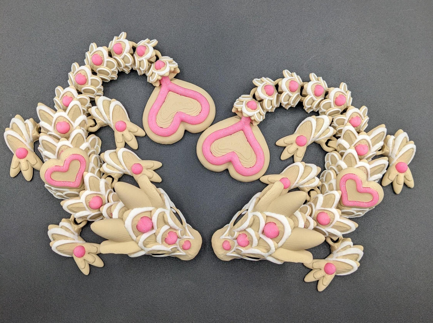 Our adorable 3D-printed dragon combines the whimsical charm of gingerbread cookies, heart-shaped details, & the playful personality of a baby dragon. Whether it’s a holiday gift, an enchanted companion, or a fun fidget toy, this dragon is perfect!