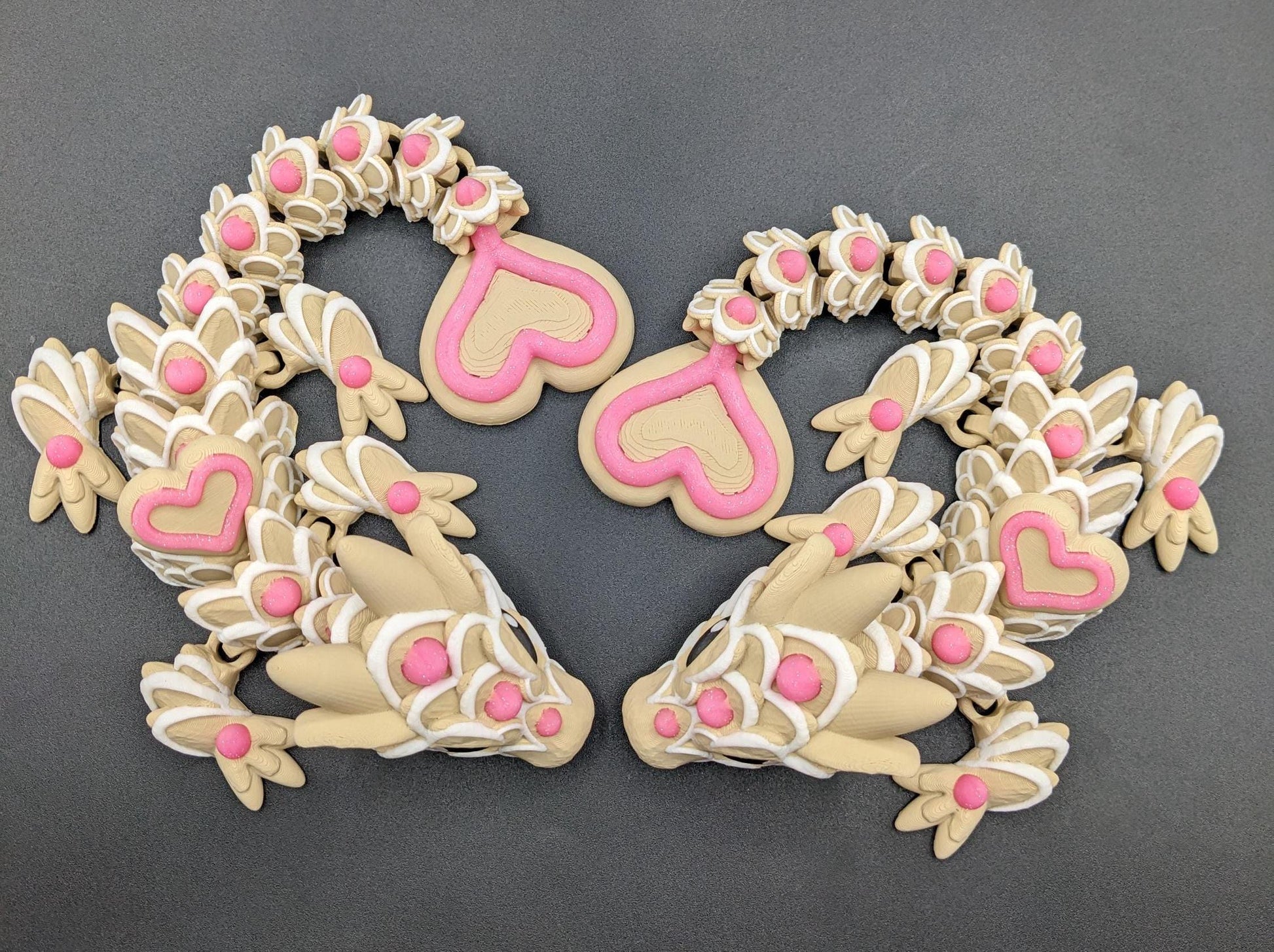Our adorable 3D-printed dragon combines the whimsical charm of gingerbread cookies, heart-shaped details, & the playful personality of a baby dragon. Whether it’s a holiday gift, an enchanted companion, or a fun fidget toy, this dragon is perfect!