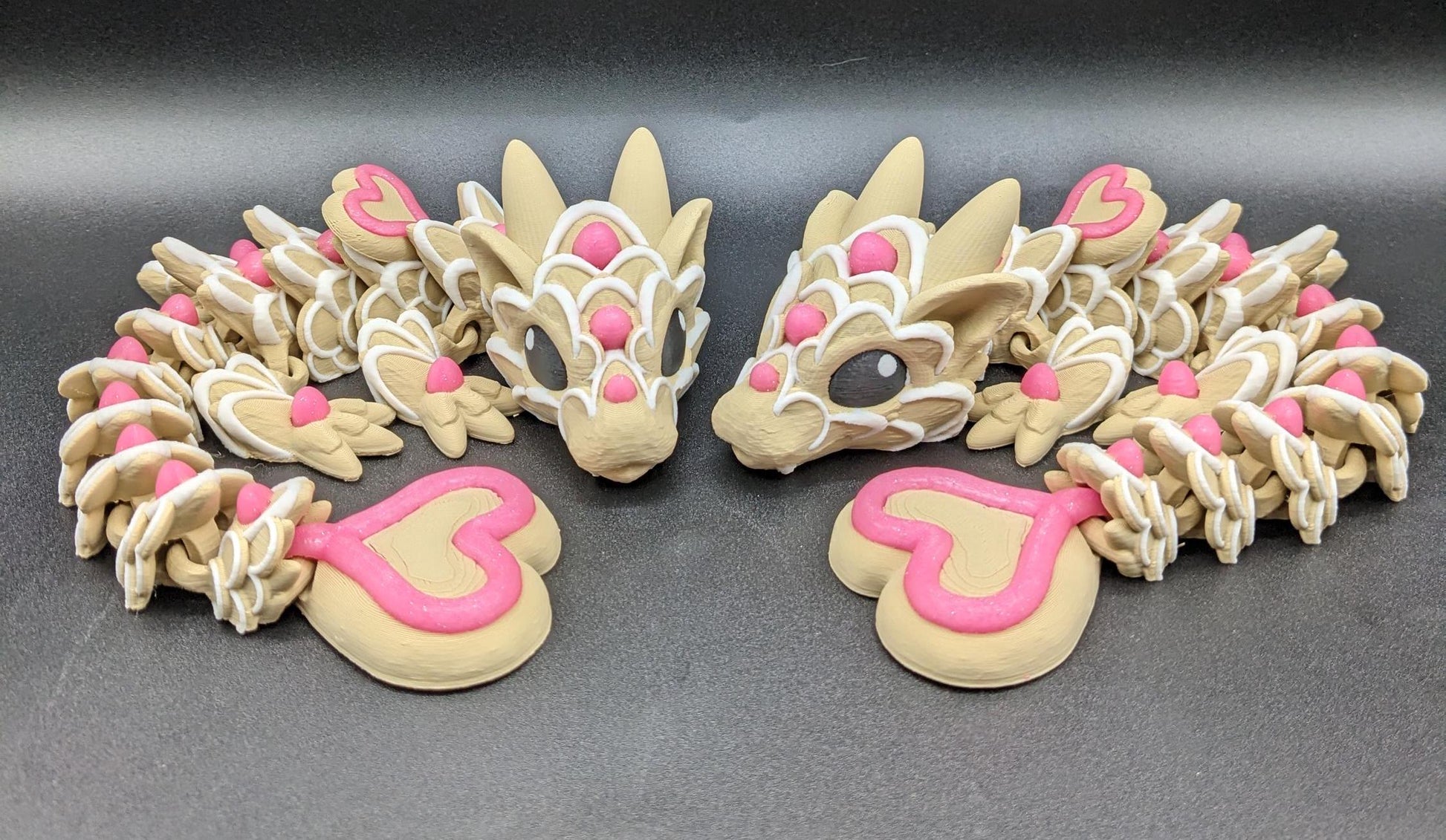Our adorable 3D-printed dragon combines the whimsical charm of gingerbread cookies, heart-shaped details, & the playful personality of a baby dragon. Whether it’s a holiday gift, an enchanted companion, or a fun fidget toy, this dragon is perfect!