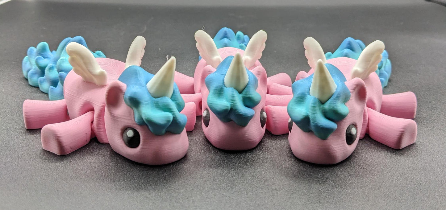 Our Magical Articulated Baby Unicorn Fidget Toy is perfect for fidgeting, imaginative play, or as a whimsical desk accessory. The perfect gift for the unicorn lover in your life or gift for yourself!