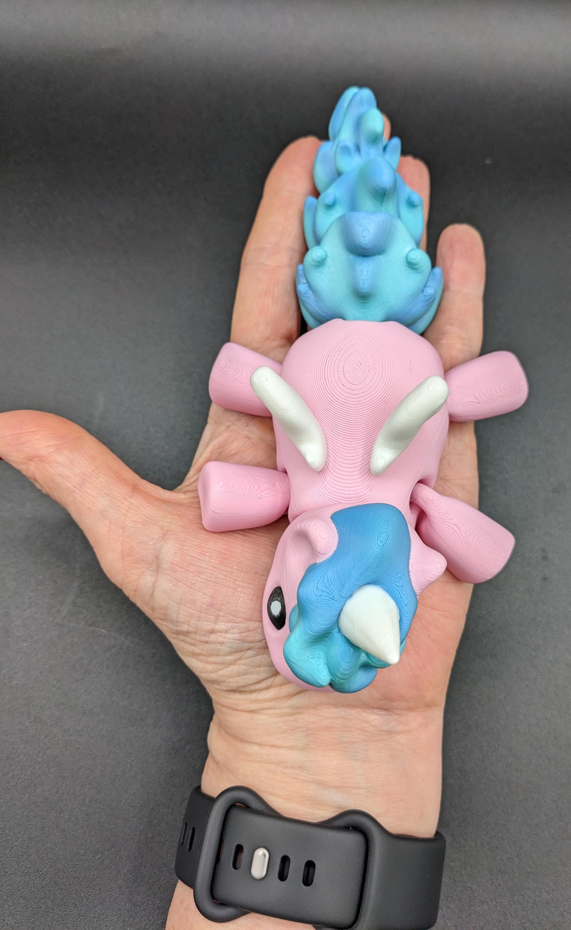Our Magical Articulated Baby Unicorn Fidget Toy is perfect for fidgeting, imaginative play, or as a whimsical desk accessory. The perfect gift for the unicorn lover in your life or gift for yourself!