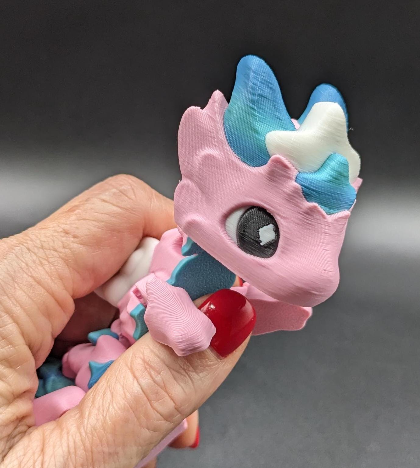 Our Sweet Articulated Baby Atria Fidget Toy is a delightful & interactive creation designed to bring joy, creativity, & stress relief into your life! Our fidget toy features a unique & sweet design making it perfect for fidgeting &  imaginative play.