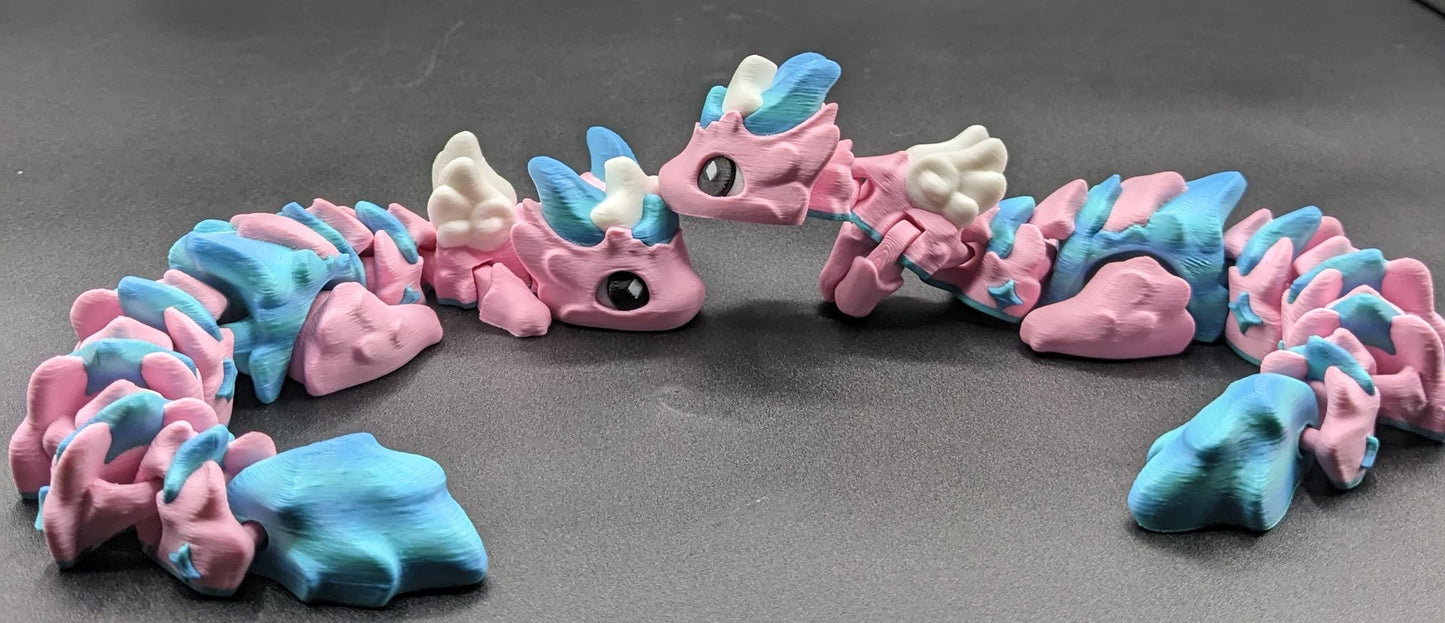Our Sweet Articulated Baby Atria Fidget Toy is a delightful & interactive creation designed to bring joy, creativity, & stress relief into your life! Our fidget toy features a unique & sweet design making it perfect for fidgeting &  imaginative play.