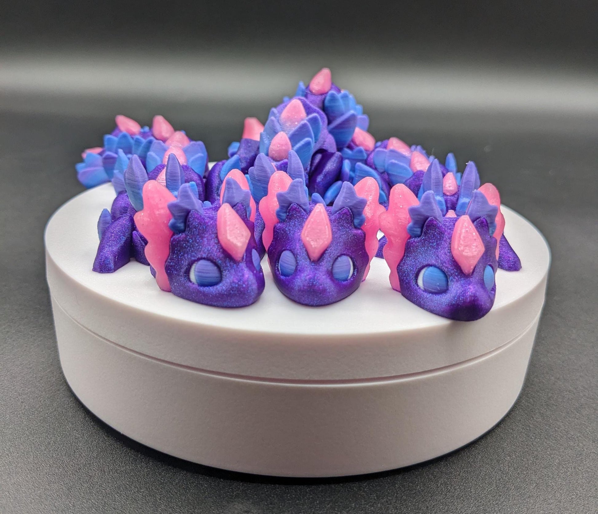 Whether you’re looking for a stress-relief toy, a whimsical desk companion, or a one-of-a-kind gift, Baby RubiKuro is here to charm kids, teens, & adults alike. Colorful, durable, & irresistibly adorable, our baby dragon is the perfect companion.