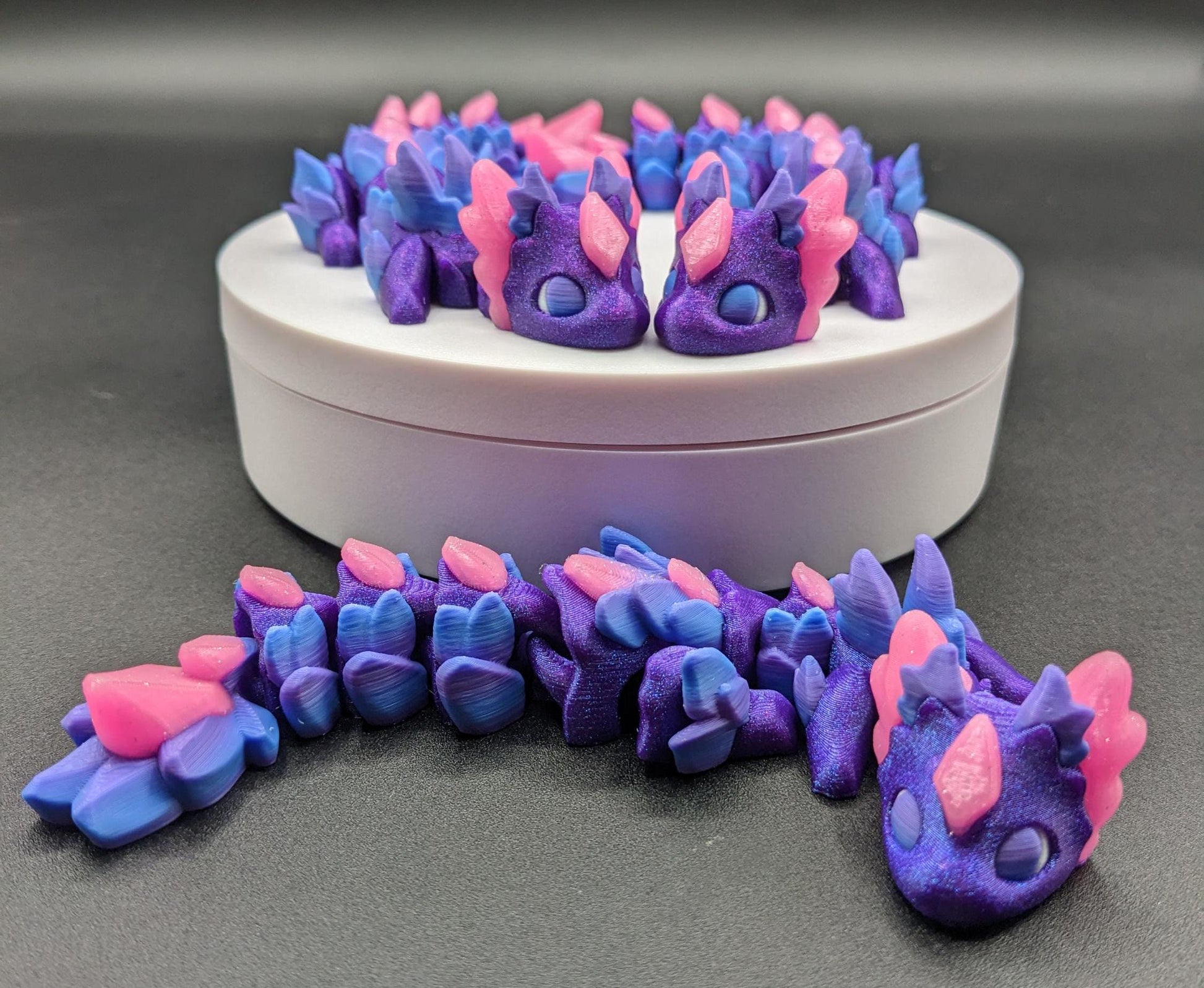 Whether you’re looking for a stress-relief toy, a whimsical desk companion, or a one-of-a-kind gift, Baby RubiKuro is here to charm kids, teens, & adults alike. Colorful, durable, & irresistibly adorable, our baby dragon is the perfect companion.