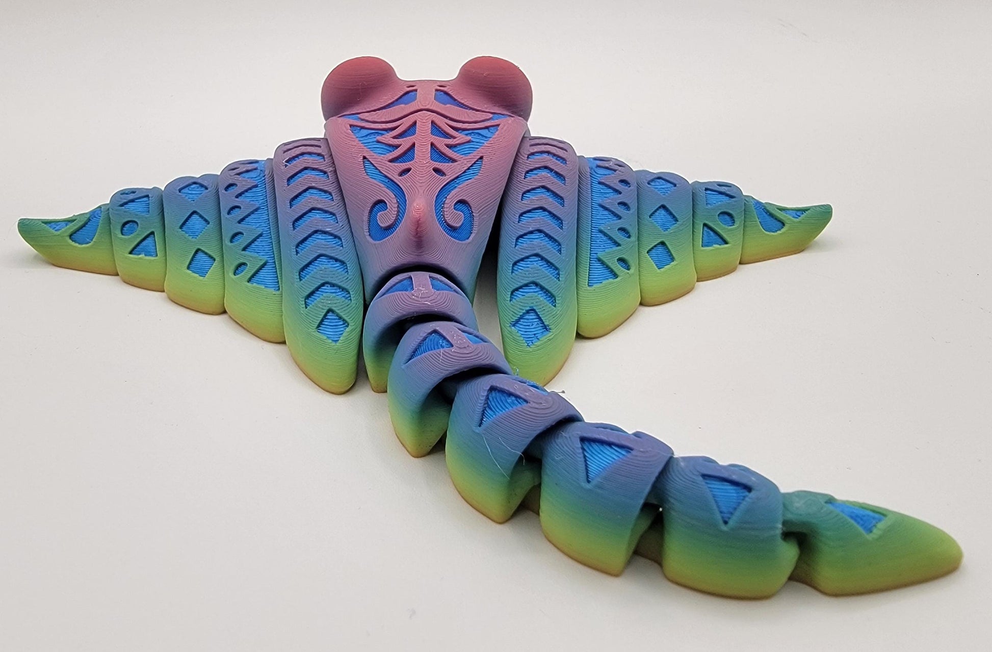 Meet our adorable 3D Printed Tribal Tattooed Manta Ray Fidget Toy – your companion for stress relief and endless fun! Crafted with precision, this Tattooed Manta Ray is more than just a toy; it's a delightful escape from the daily hustle.