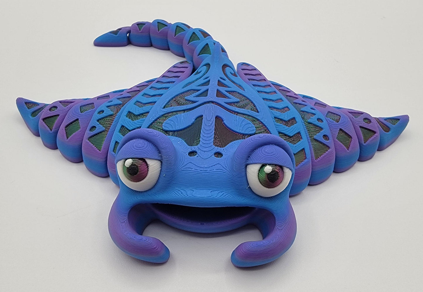 Meet our adorable 3D Printed Tribal Tattooed Manta Ray Fidget Toy – your companion for stress relief and endless fun! Crafted with precision, this Tattooed Manta Ray is more than just a toy; it's a delightful escape from the daily hustle.