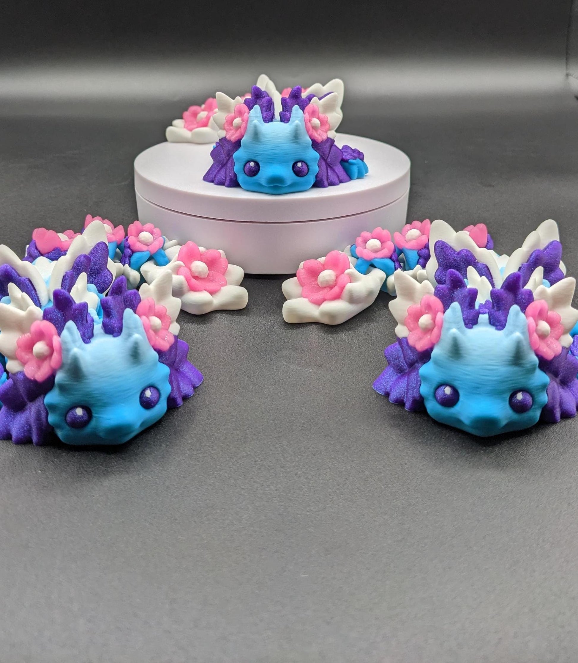 Let the Adorable Baby Kosha Axolotl Flower Dragon bring joy, relaxation, & a touch of enchantment into your life! Whether you’re treating yourself or someone special, this charming fidget toy is a delightful combination of fantasy & creativity.