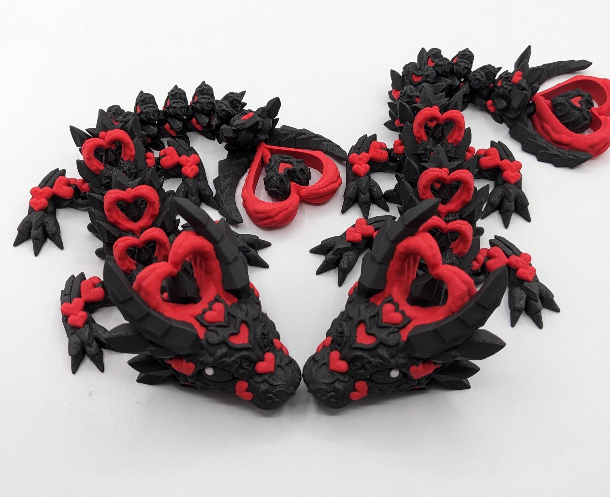 Meet the Elegant Articulated Baby Dark Heart Dragon, a stunning blend of mystery, grace, and intricate design. This captivating 3D-printed dragon is perfect for dragon enthusiasts, collectors, or anyone who loves unique and magical creations.