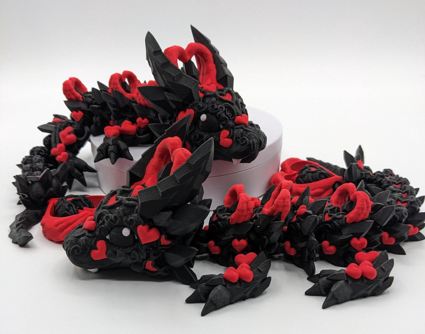 Meet the Elegant Articulated Baby Dark Heart Dragon, a stunning blend of mystery, grace, and intricate design. This captivating 3D-printed dragon is perfect for dragon enthusiasts, collectors, or anyone who loves unique and magical creations.