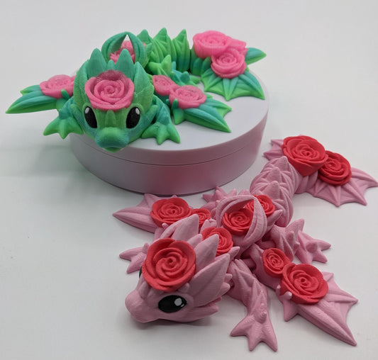 Add a touch of magic and charm to your day with the Adorable Articulated Baby Rose Dragon Fidget Toy! This enchanting 3D-printed dragon is inspired by the beauty of roses and the whimsical allure of baby dragons. The perfect Valentine's gift.