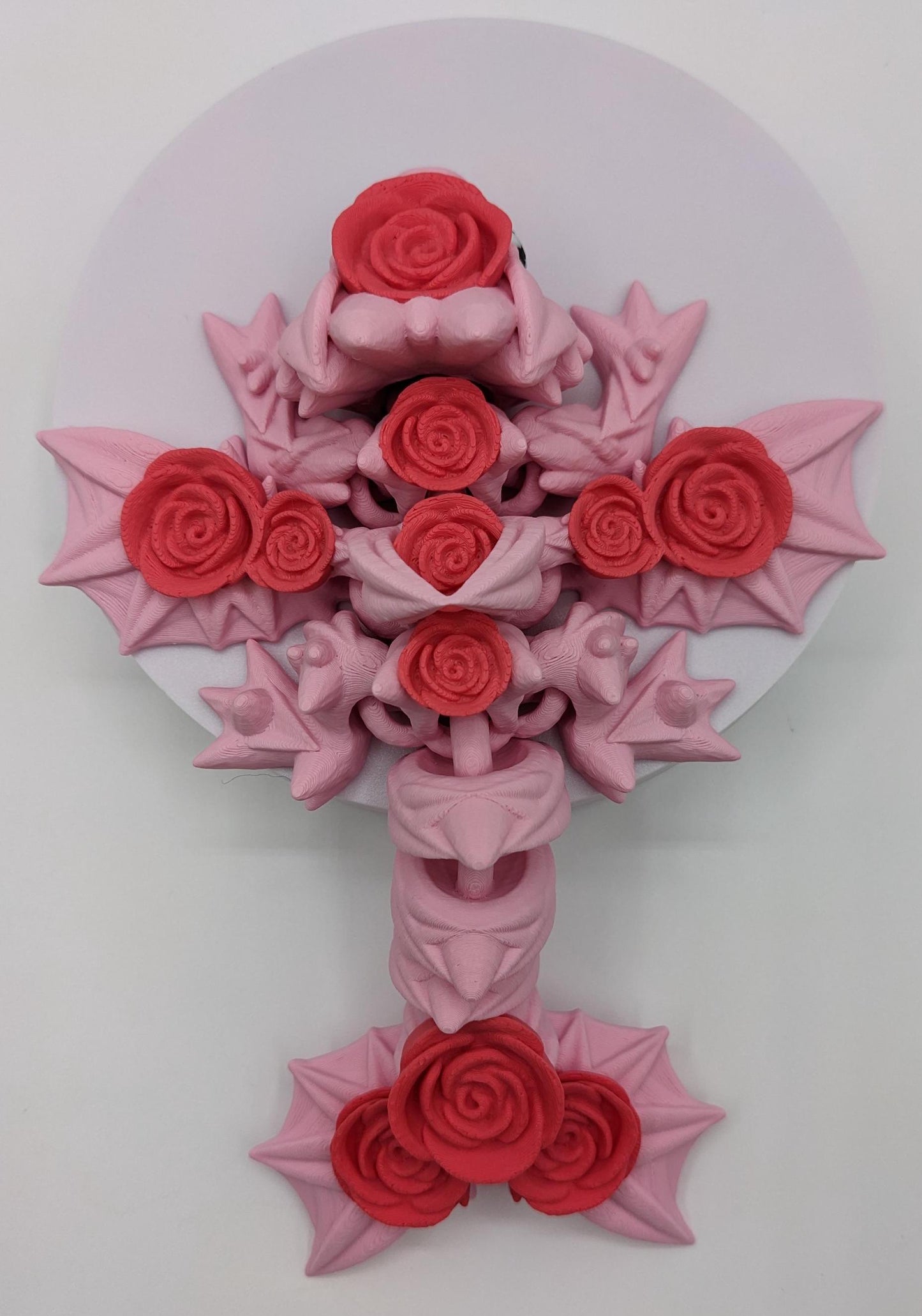 Add a touch of magic and charm to your day with the Adorable Articulated Baby Rose Dragon Fidget Toy! This enchanting 3D-printed dragon is inspired by the beauty of roses and the whimsical allure of baby dragons. The perfect Valentine's gift.