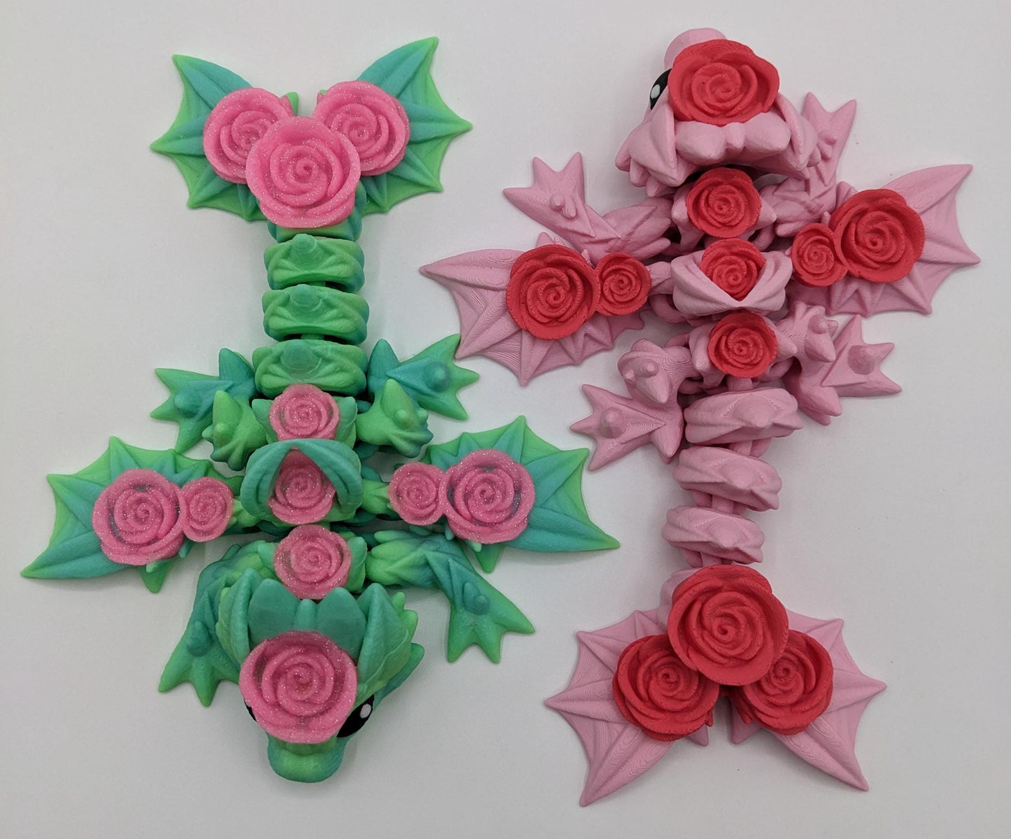 Add a touch of magic and charm to your day with the Adorable Articulated Baby Rose Dragon Fidget Toy! This enchanting 3D-printed dragon is inspired by the beauty of roses and the whimsical allure of baby dragons. The perfect Valentine's gift.