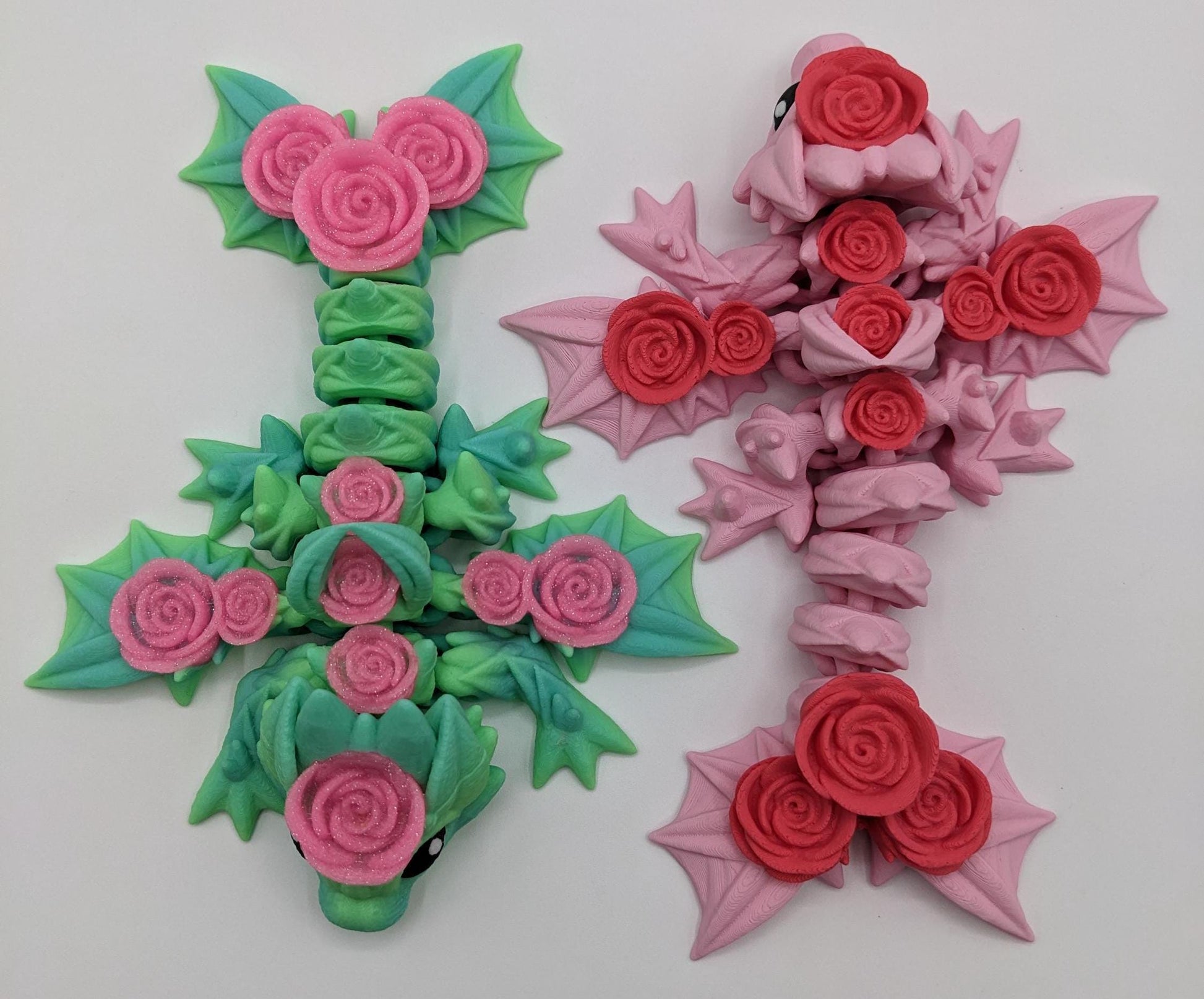 Add a touch of magic and charm to your day with the Adorable Articulated Baby Rose Dragon Fidget Toy! This enchanting 3D-printed dragon is inspired by the beauty of roses and the whimsical allure of baby dragons. The perfect Valentine's gift.