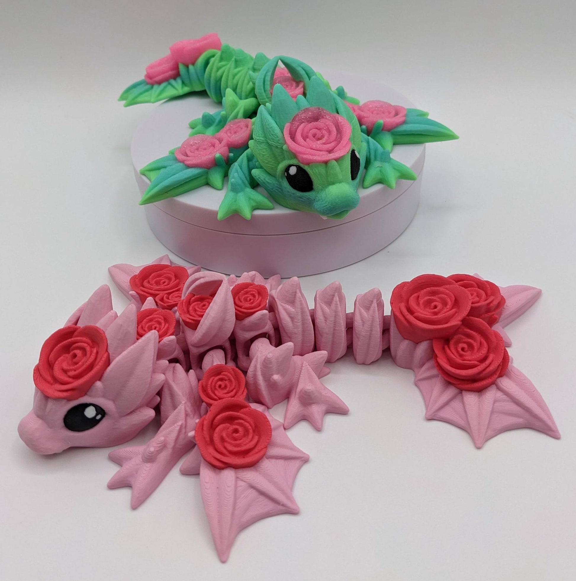 Add a touch of magic and charm to your day with the Adorable Articulated Baby Rose Dragon Fidget Toy! This enchanting 3D-printed dragon is inspired by the beauty of roses and the whimsical allure of baby dragons. The perfect Valentine's gift.