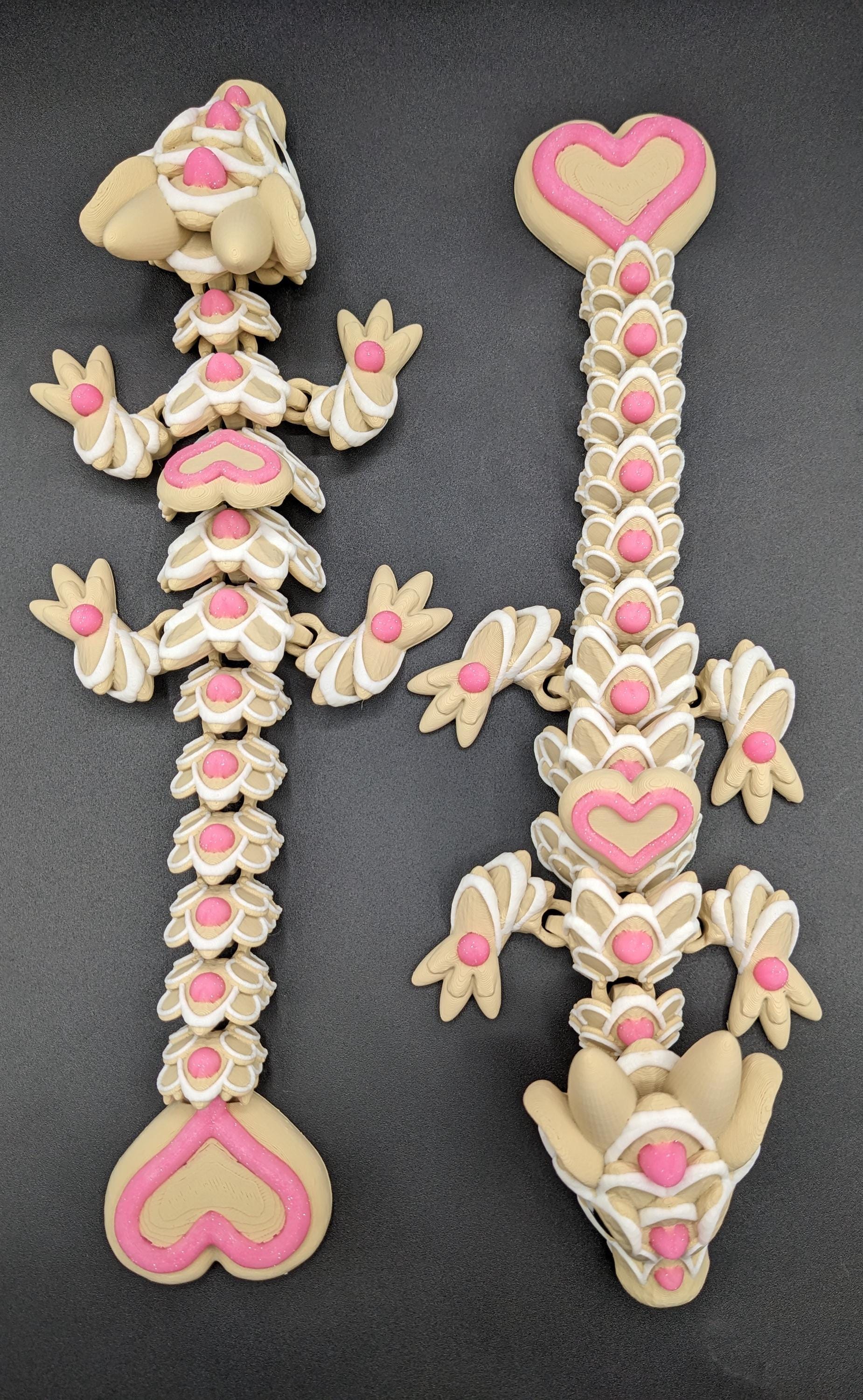 Our adorable 3D-printed dragon combines the whimsical charm of gingerbread cookies, heart-shaped details, & the playful personality of a baby dragon. Whether it’s a holiday gift, an enchanted companion, or a fun fidget toy, this dragon is perfect!