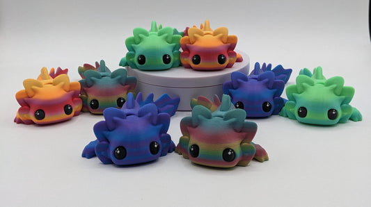 Meet the Adorable Articulated Axolotl Tadpole Fidget Toy, the perfect blend of cuteness and functionality! This 3D-printed axolotl-inspired design features fully articulated joints, making it both fun to fidget with and charming to display.