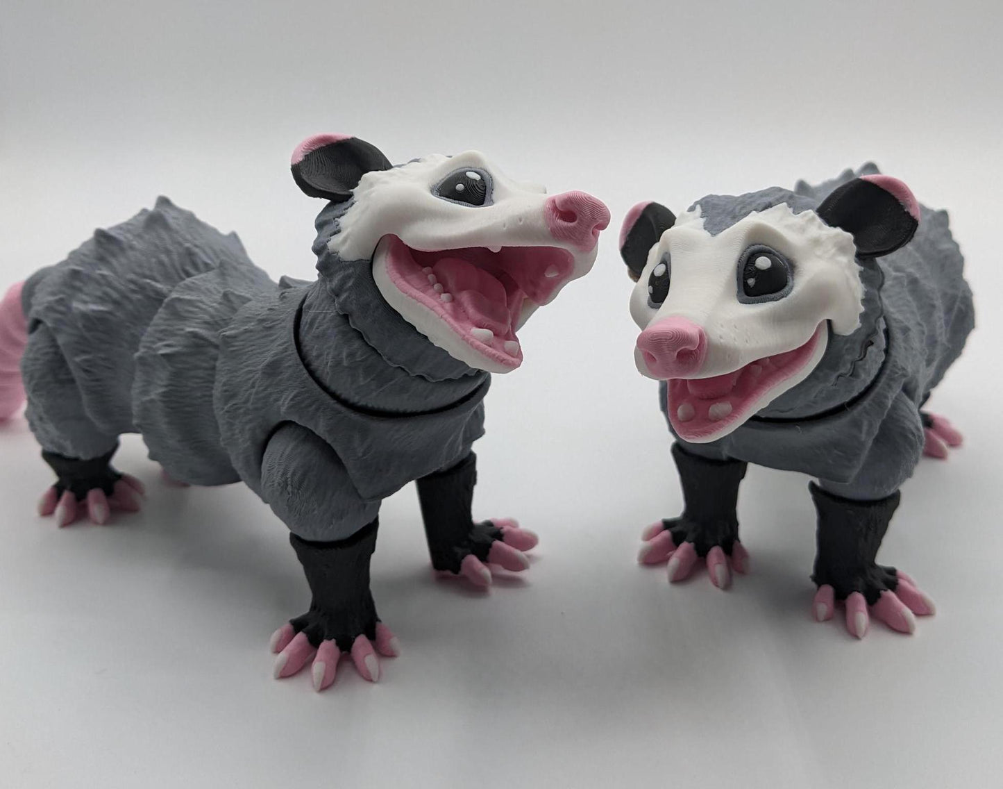 Bring a little mischief and charm to your life with the Articulated Opossum Toy Fidget! This adorable 3D-printed creation is perfect for opossum lovers, fidget toy enthusiasts, or anyone looking for a unique and playful stress reliever.