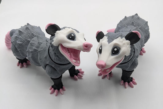 Bring a little mischief and charm to your life with the Articulated Opossum Toy Fidget! This adorable 3D-printed creation is perfect for opossum lovers, fidget toy enthusiasts, or anyone looking for a unique and playful stress reliever.