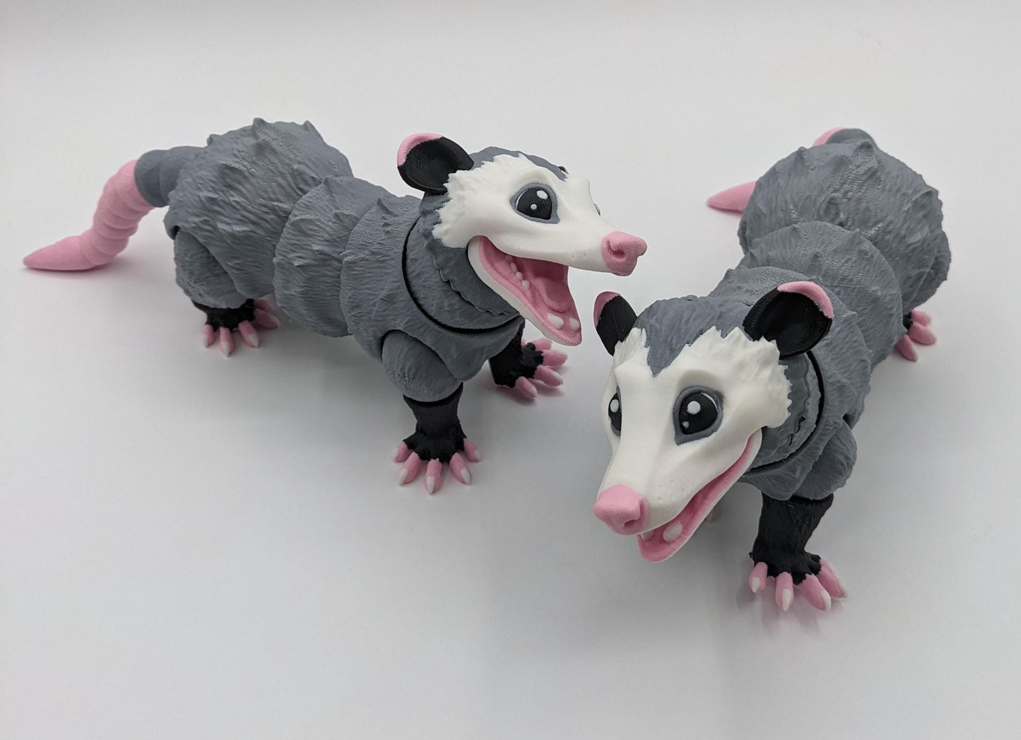 Bring a little mischief and charm to your life with the Articulated Opossum Toy Fidget! This adorable 3D-printed creation is perfect for opossum lovers, fidget toy enthusiasts, or anyone looking for a unique and playful stress reliever.