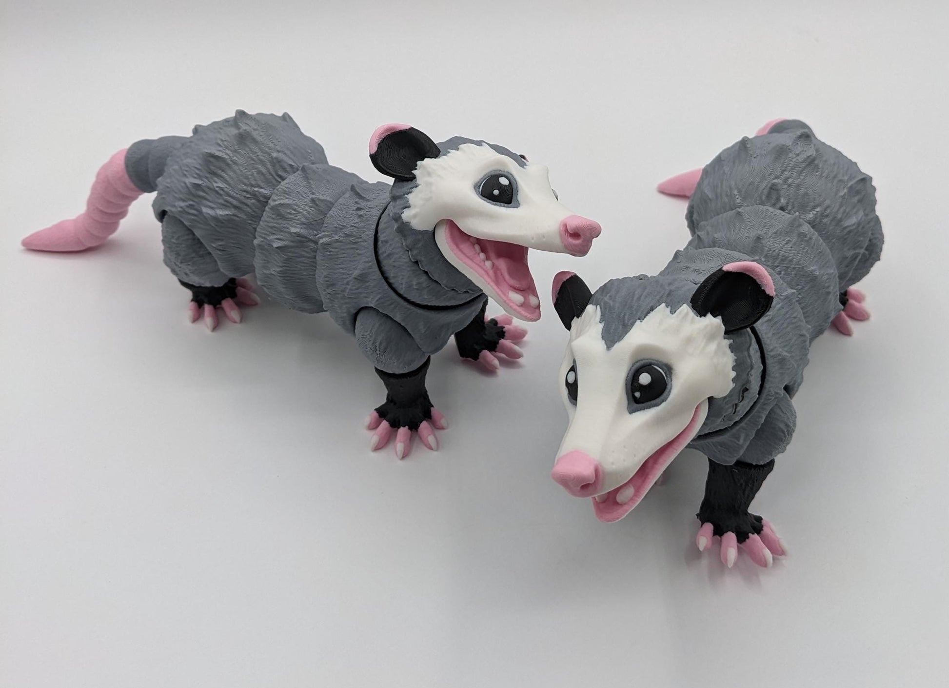 Bring a little mischief and charm to your life with the Articulated Opossum Toy Fidget! This adorable 3D-printed creation is perfect for opossum lovers, fidget toy enthusiasts, or anyone looking for a unique and playful stress reliever.