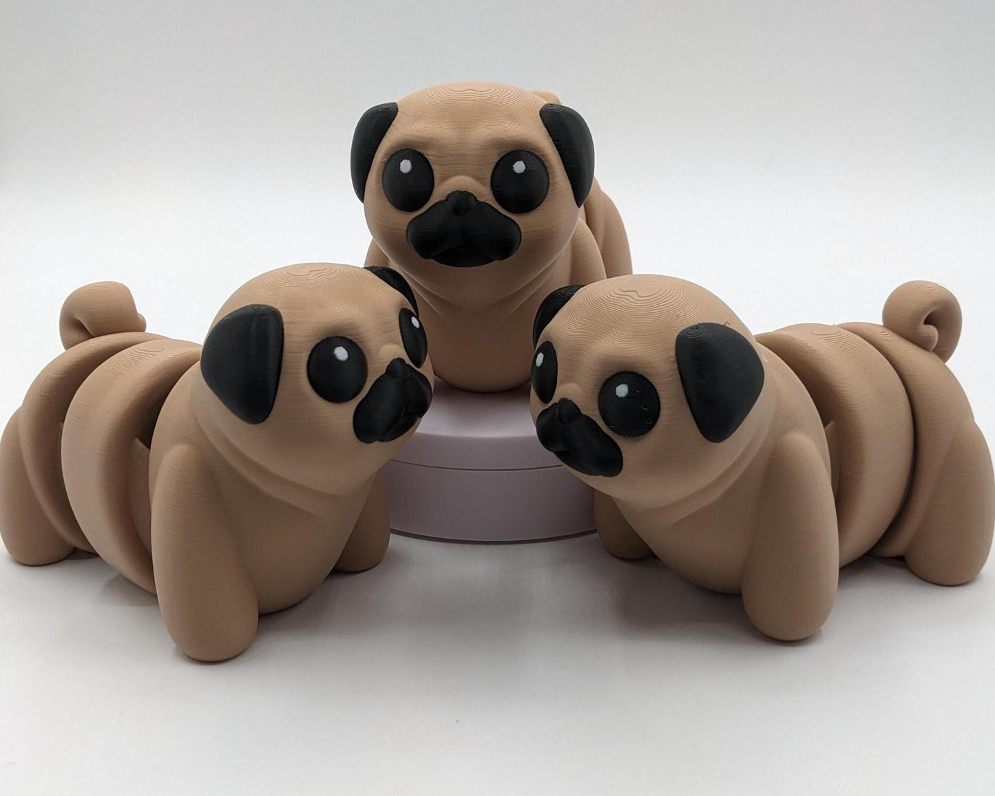 Man's best friend & the clown of the dog breeds, our adorable pug with it's larger size makes it even more fun to handle, while capturing the mischievous charm of your puggy friend. Whether you’re looking for a unique gift, a relaxing fidget toy, or a playful decoration, this pug puppy will bring endless joy & stress relief.