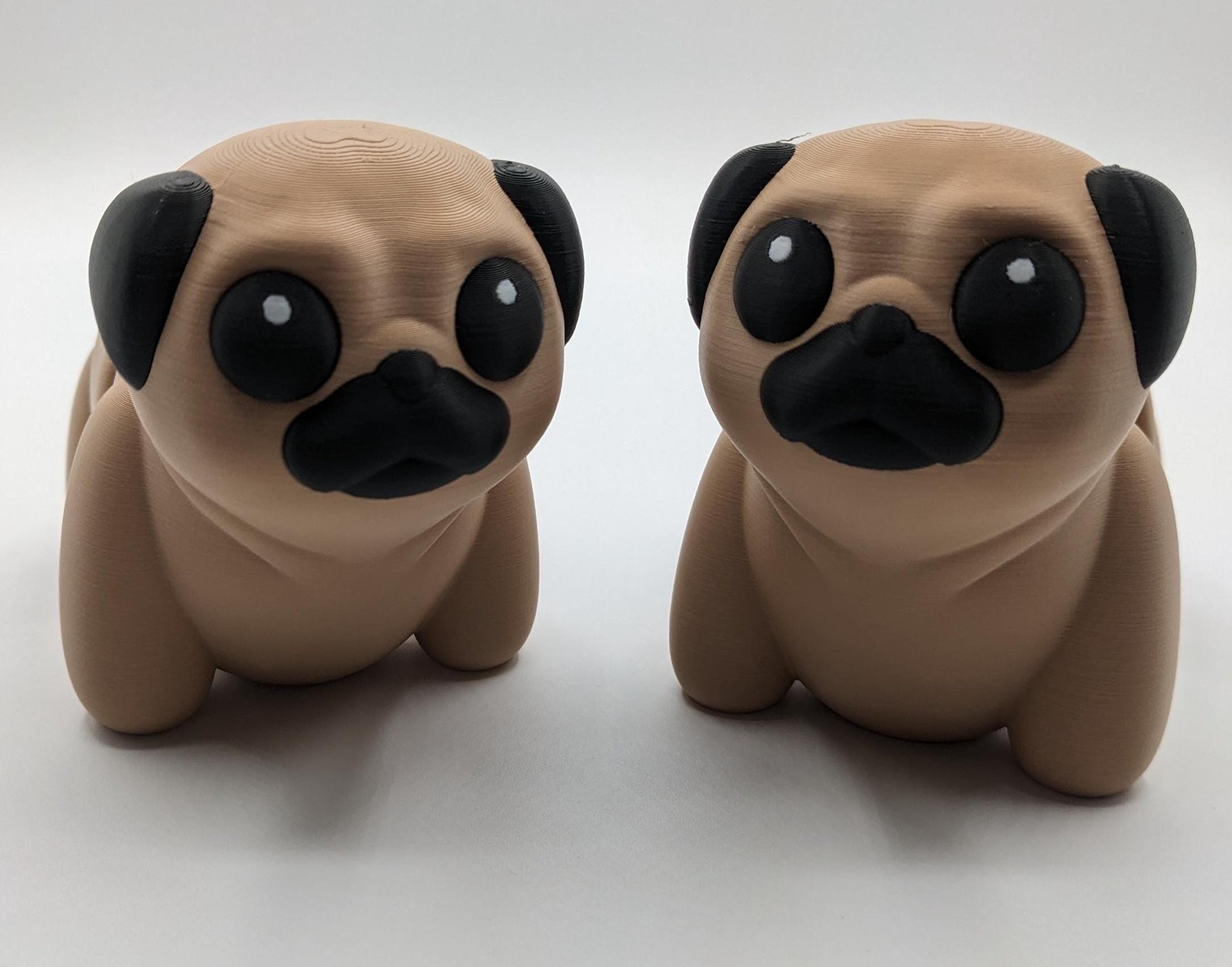 Man's best friend & the clown of the dog breeds, our adorable pug with it's larger size makes it even more fun to handle, while capturing the mischievous charm of your puggy friend. Whether you’re looking for a unique gift, a relaxing fidget toy, or a playful decoration, this pug puppy will bring endless joy & stress relief.