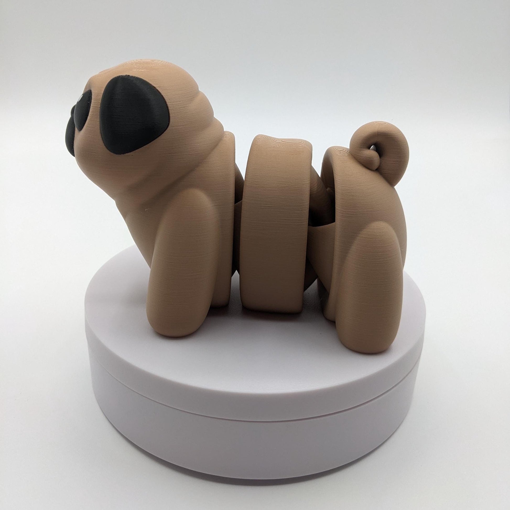 Man's best friend & the clown of the dog breeds, our adorable pug with it's larger size makes it even more fun to handle, while capturing the mischievous charm of your puggy friend. Whether you’re looking for a unique gift, a relaxing fidget toy, or a playful decoration, this pug puppy will bring endless joy & stress relief.