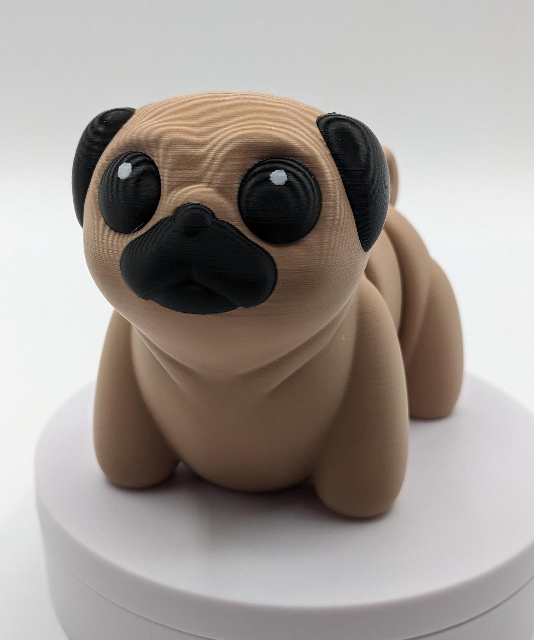 Man's best friend & the clown of the dog breeds, our adorable pug with it's larger size makes it even more fun to handle, while capturing the mischievous charm of your puggy friend. Whether you’re looking for a unique gift, a relaxing fidget toy, or a playful decoration, this pug puppy will bring endless joy & stress relief.