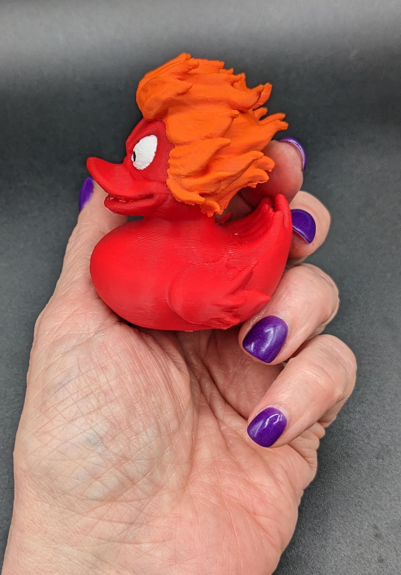Our fiery duck combines a fierce design with playful charm, making it the perfect gift for the Jeep duck collectors, fidget toy enthusiasts, or anyone looking to add a spark to their decor. With its vibrant fiery colors and detailed craftsmanship, this duck is a true standout.