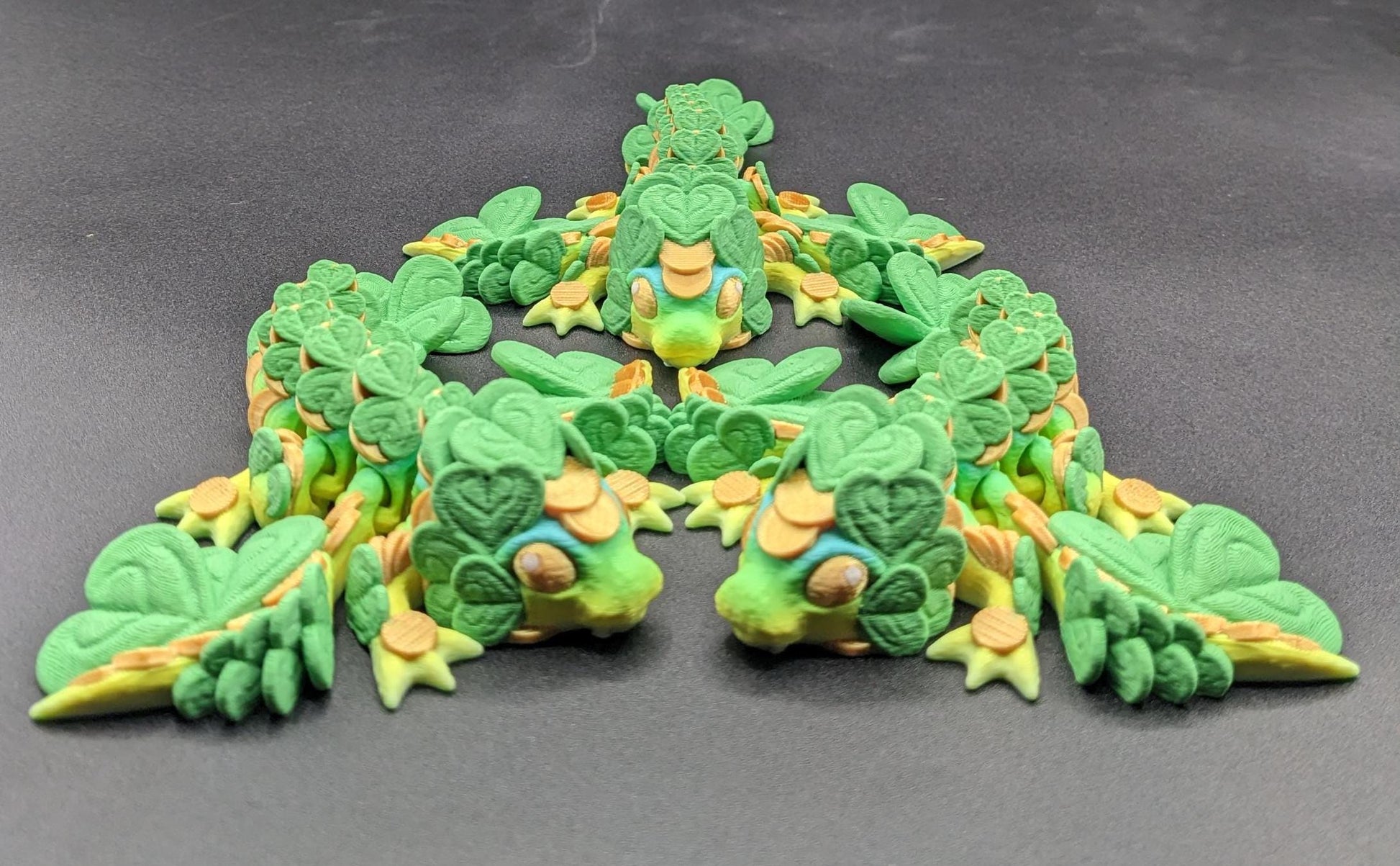 Meet our Adorable Tiny Baby Clover Dragon featuring intricate details & whimsical design, inspired by the luck & charm of clovers. Perfect for dragon enthusiasts or anyone who loves all things small. With the luck of the leprechaun, this little dragon is the perfect lucky charm. Small enough to carry in your pocket or display on desks, shelves, or computer.