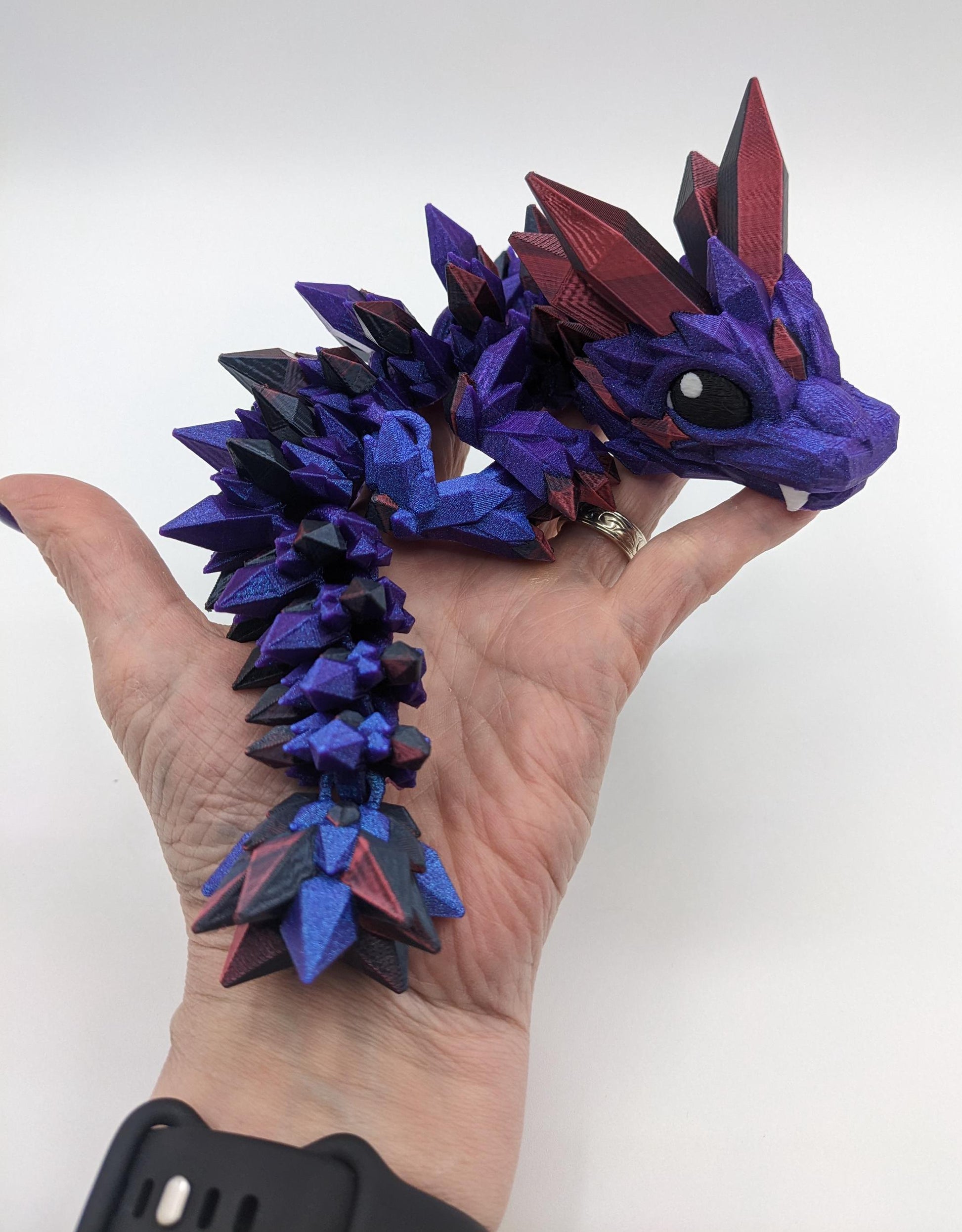 Bring a touch of magic to your life with the Adorable Articulated Baby Crystal Dragon! This 3D-printed masterpiece is designed with intricate details and fully articulated joints, making it a playful and poseable collectible that’s perfect for dragon lovers, fantasy fans, and unique gift seekers. Inspired by the elegance of crystals and the charm of baby dragons, this figurine is both whimsical and eye-catching.