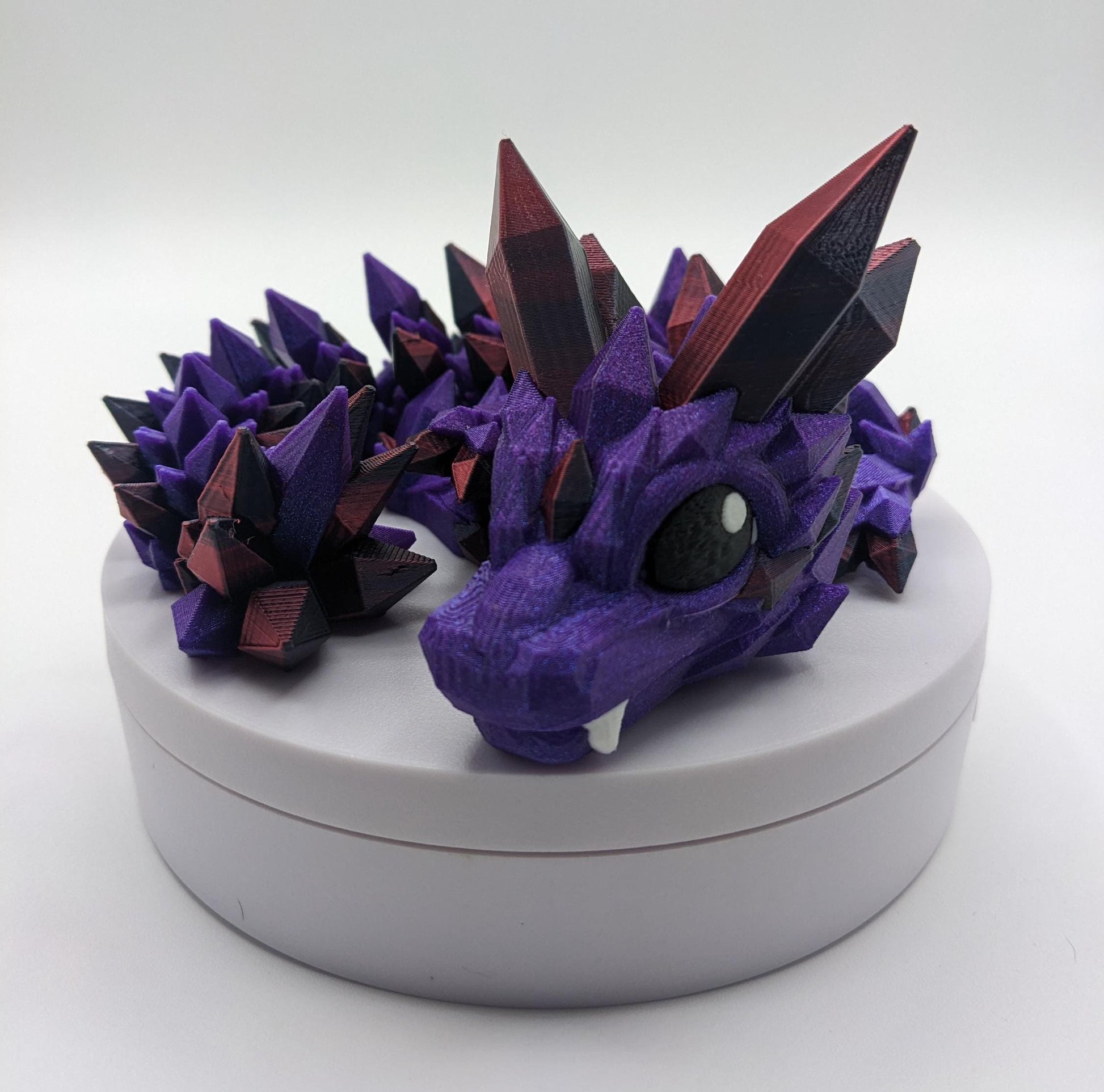 Bring a touch of magic to your life with the Adorable Articulated Baby Crystal Dragon! This 3D-printed masterpiece is designed with intricate details and fully articulated joints, making it a playful and poseable collectible that’s perfect for dragon lovers, fantasy fans, and unique gift seekers. Inspired by the elegance of crystals and the charm of baby dragons, this figurine is both whimsical and eye-catching.