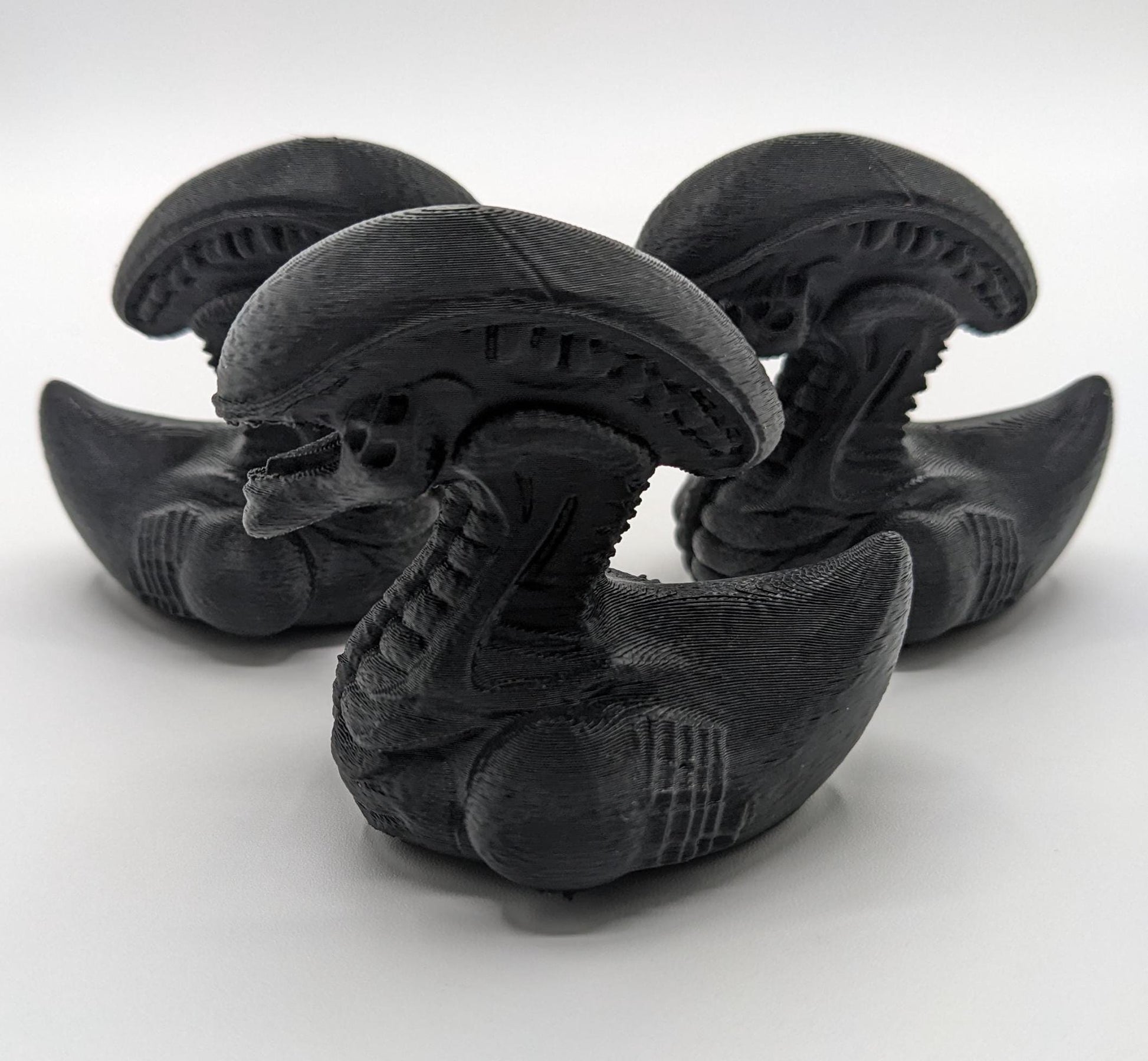 Step into the world of sci-fi and whimsy with the Alien Xenomorph Duck! This one-of-a-kind 3D-printed creation combines the eerie, iconic design of an alien xenomorph with the playful charm of a duck. Perfect for fans of alien creatures, sci-fi enthusiasts, Jeep duck collectors, or anyone who loves quirky collectibles, this hybrid figurine is sure to stand out in any collection.