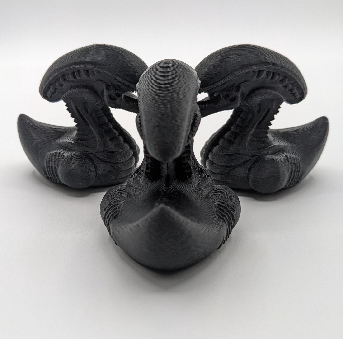 Step into the world of sci-fi and whimsy with the Alien Xenomorph Duck! This one-of-a-kind 3D-printed creation combines the eerie, iconic design of an alien xenomorph with the playful charm of a duck. Perfect for fans of alien creatures, sci-fi enthusiasts, Jeep duck collectors, or anyone who loves quirky collectibles, this hybrid figurine is sure to stand out in any collection.