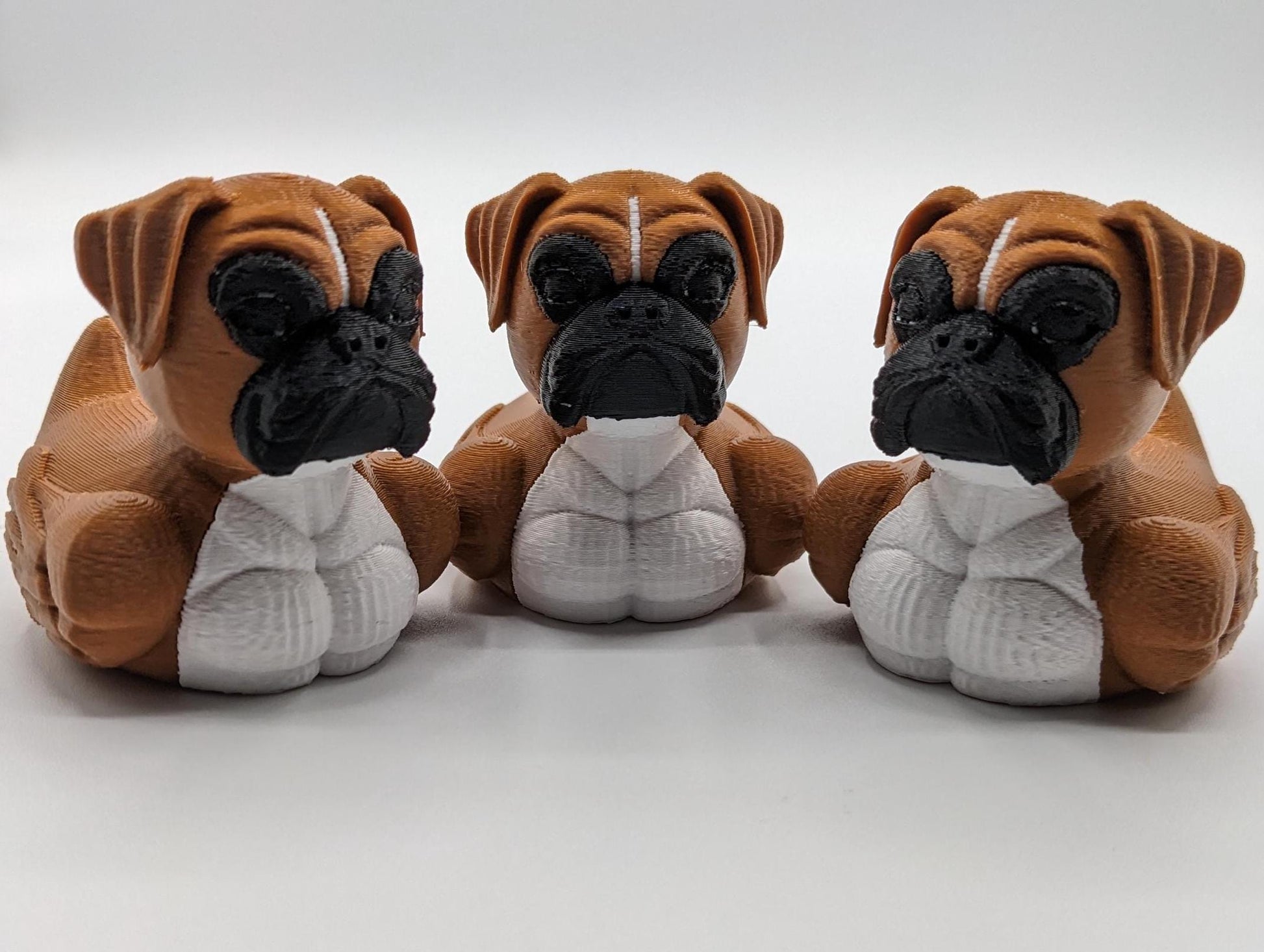 Meet The Magnificent Boxer Duck, a creative and charming 3D-printed hybrid that combines the strong, playful personality of a Boxer dog with the whimsical charm of a duck! This one-of-a-kind figurine is perfect for Boxer lovers, dog enthusiasts, Jeep duck collectors, or anyone who enjoys quirky and imaginative decor. Whether displayed on a shelf, a Jeep dash, added to your collection, or given as a thoughtful gift, this Boxer Duck is guaranteed to bring smiles and brighten up any room.