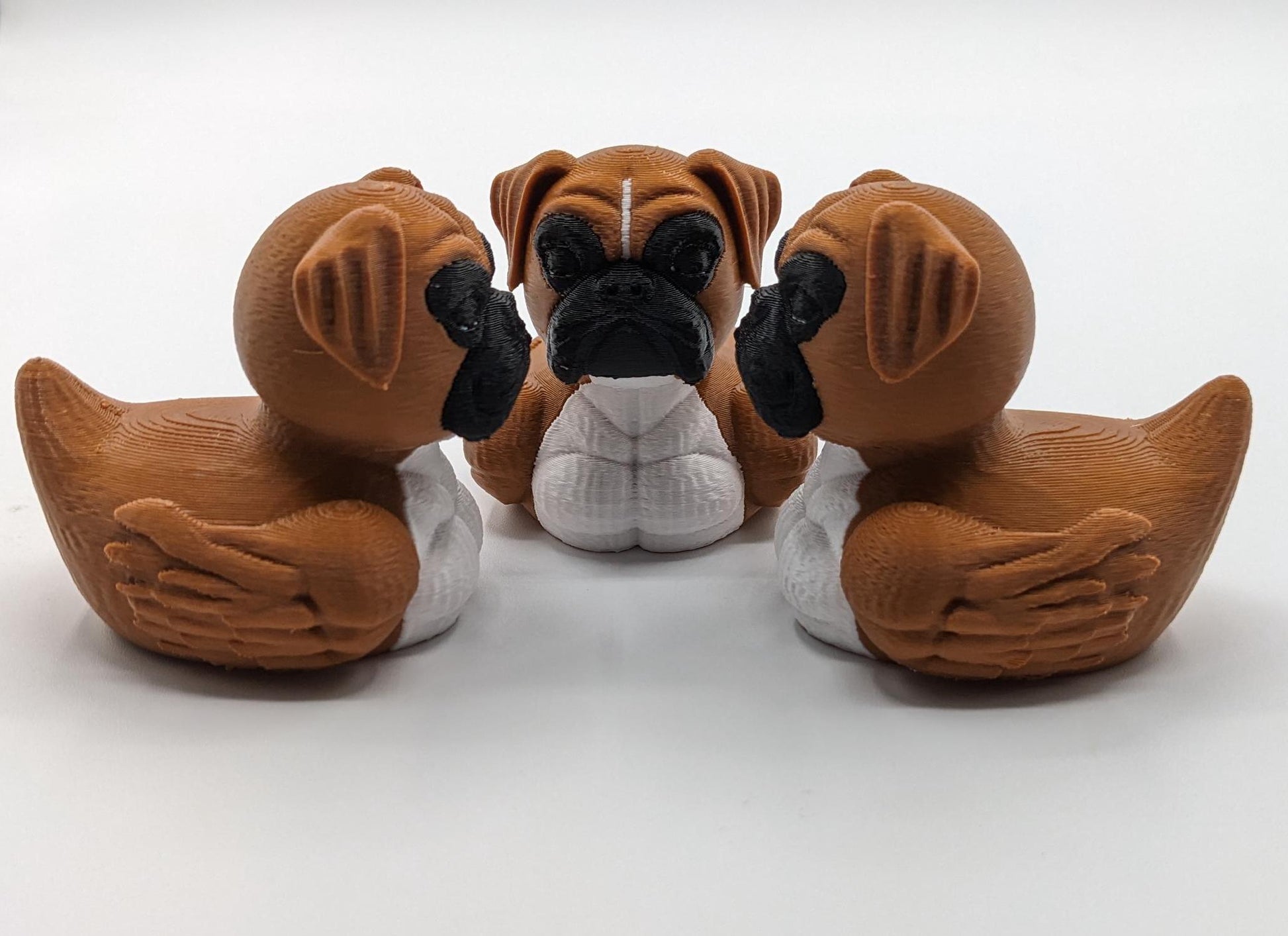 Meet The Magnificent Boxer Duck, a creative and charming 3D-printed hybrid that combines the strong, playful personality of a Boxer dog with the whimsical charm of a duck! This one-of-a-kind figurine is perfect for Boxer lovers, dog enthusiasts, Jeep duck collectors, or anyone who enjoys quirky and imaginative decor. Whether displayed on a shelf, a Jeep dash, added to your collection, or given as a thoughtful gift, this Boxer Duck is guaranteed to bring smiles and brighten up any room.