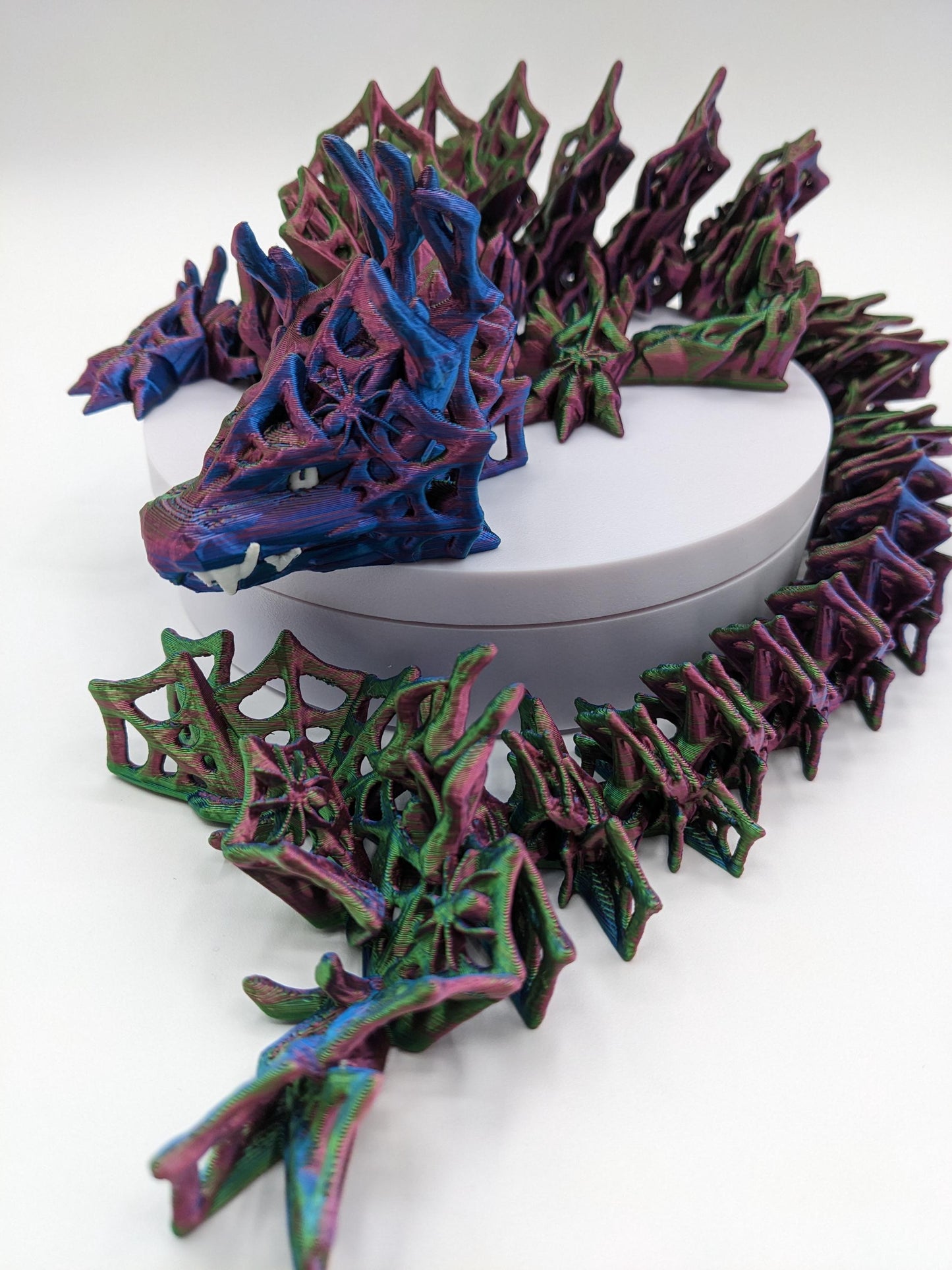 Embrace the allure of darkness and fantasy with the 3D Printed Wicked Dragon by Cinderwing. Order yours today and let this mesmerizing creature take you on a journey into the shadows. Don't miss the opportunity to own a piece of art that celebrates the mystique of the wicked and the extraordinary.