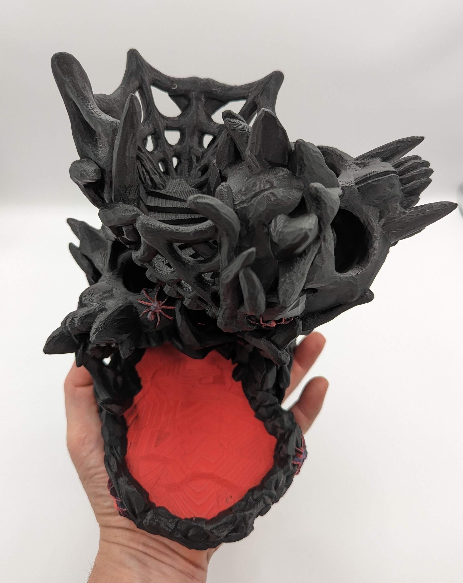 Handcrafted with eerie detail, this 3D printed dice tower combines functionality with a touch of the macabre, making it the perfect addition to any tabletop game. Whether you're a seasoned gamer or a newcomer, this spooky accessory is designed to enhance your gameplay with a chilling twist.