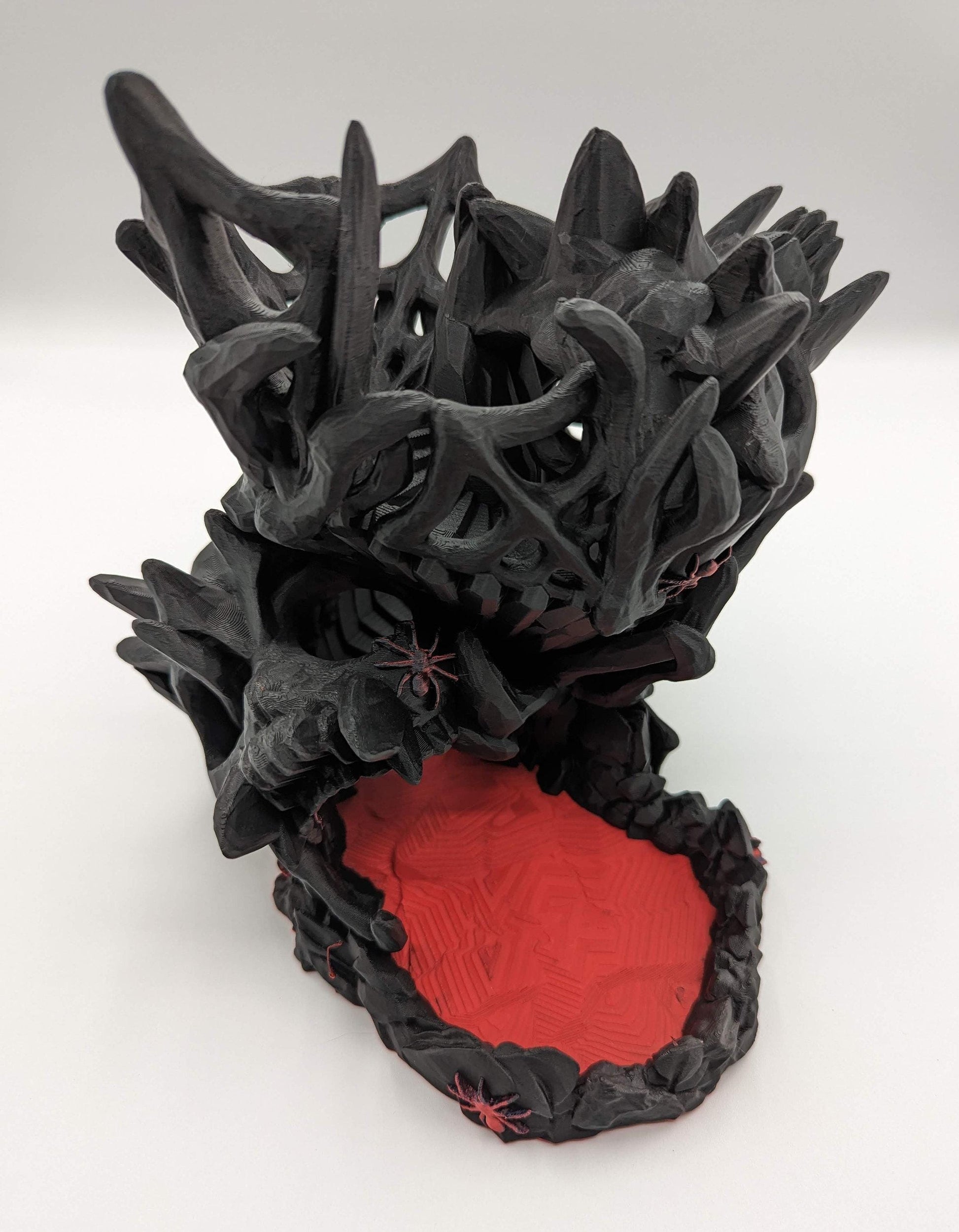 Handcrafted with eerie detail, this 3D printed dice tower combines functionality with a touch of the macabre, making it the perfect addition to any tabletop game. Whether you're a seasoned gamer or a newcomer, this spooky accessory is designed to enhance your gameplay with a chilling twist.